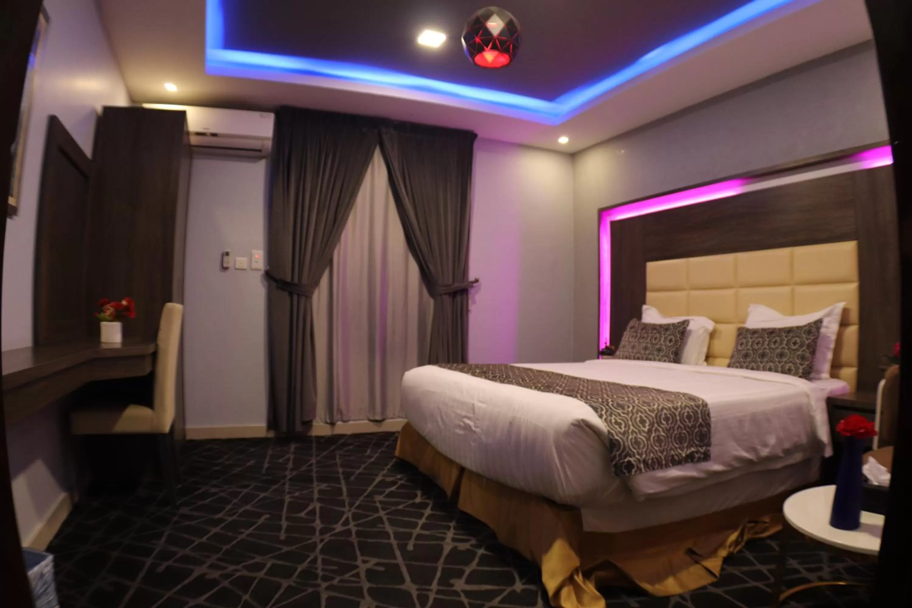 Bed in Maskan Al Dyafah Hotel Apartments