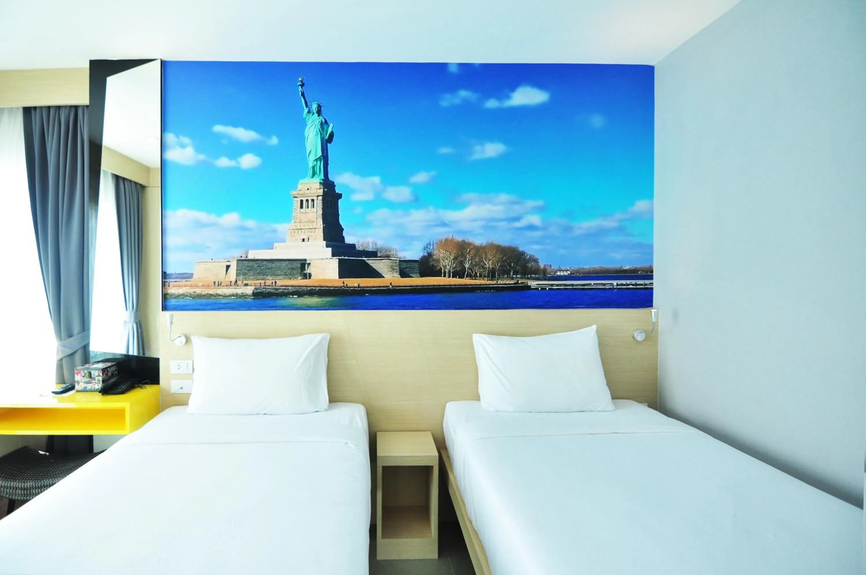 Bed in The AIM Patong Hotel