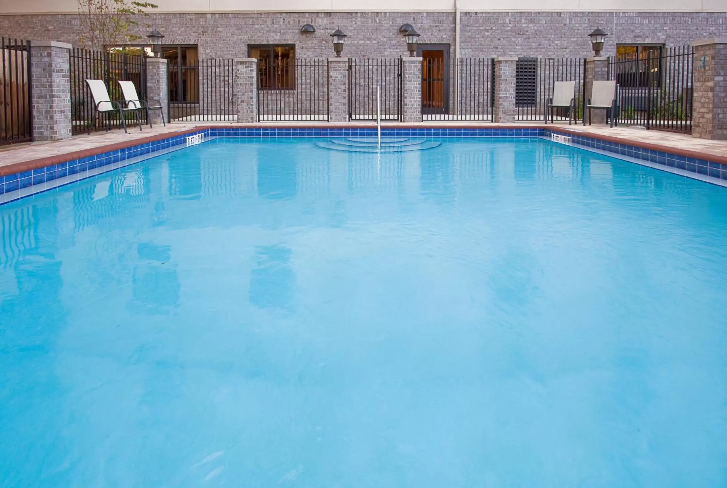 Swimming Pool in Holiday Inn Express Hotel & Suites Pensacola-West Navy Base, an IHG Hotel