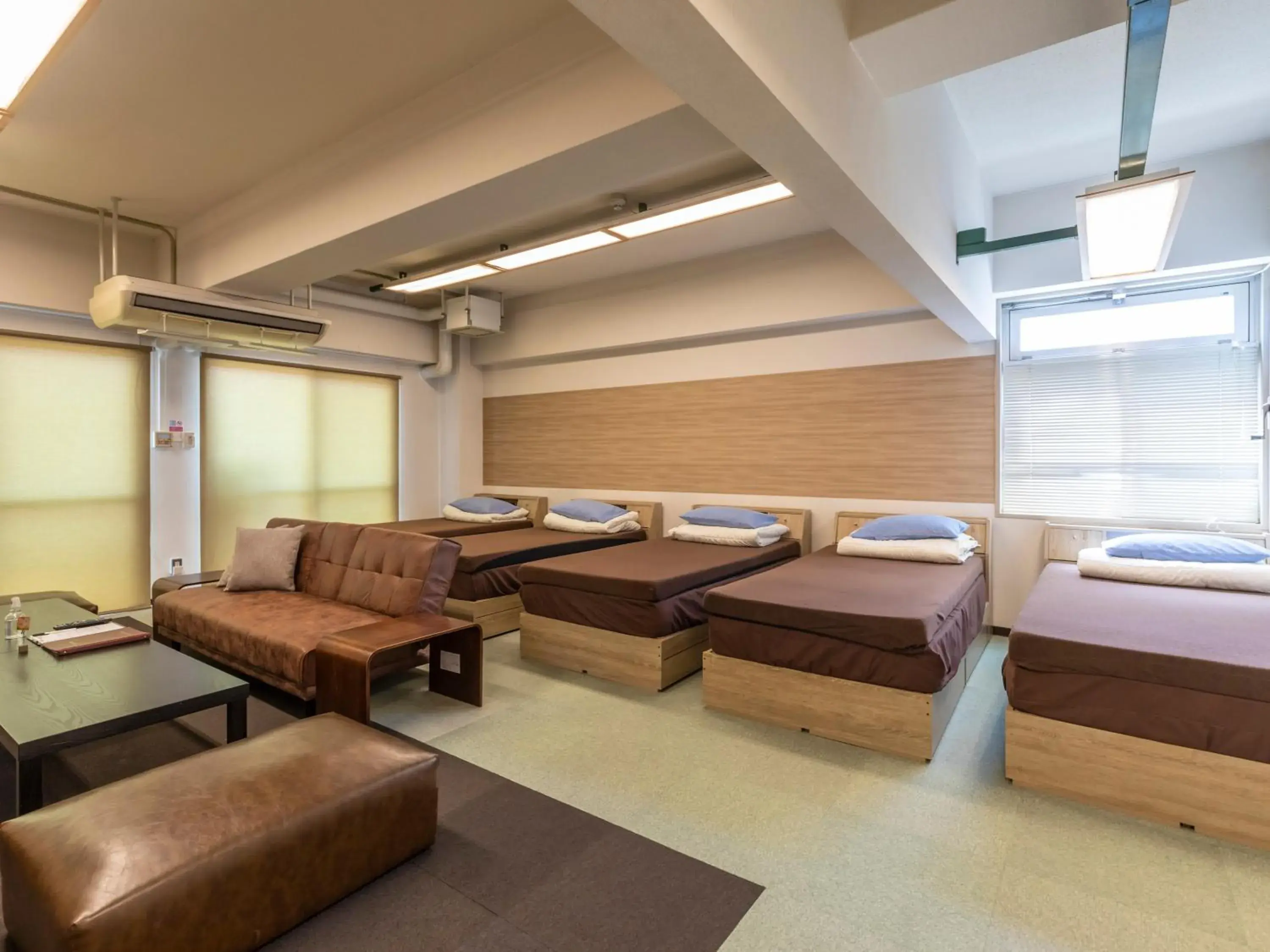 Bed, Seating Area in Omotenashi Hostel Miyajima