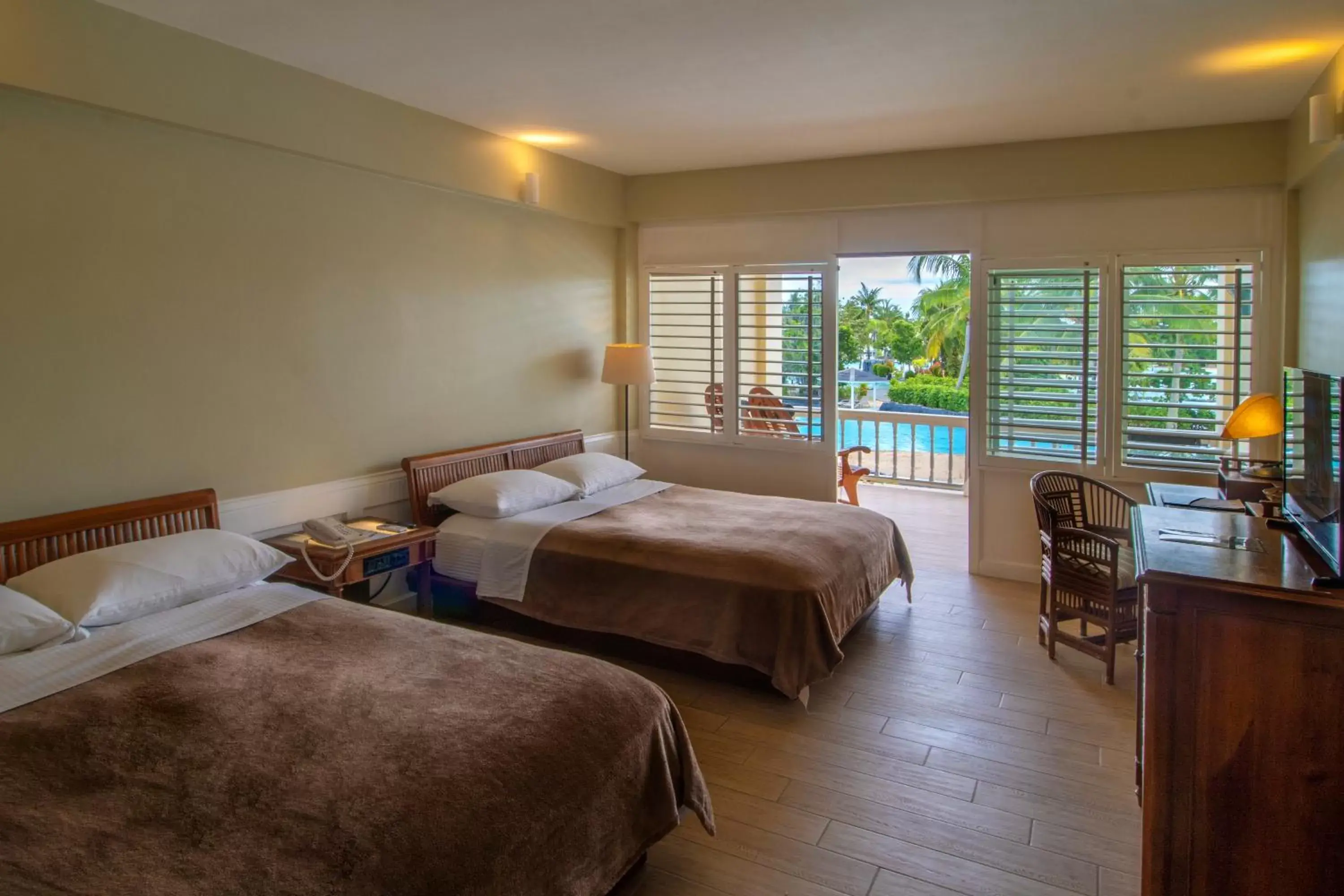 Bed in Plantation Bay Resort and Spa