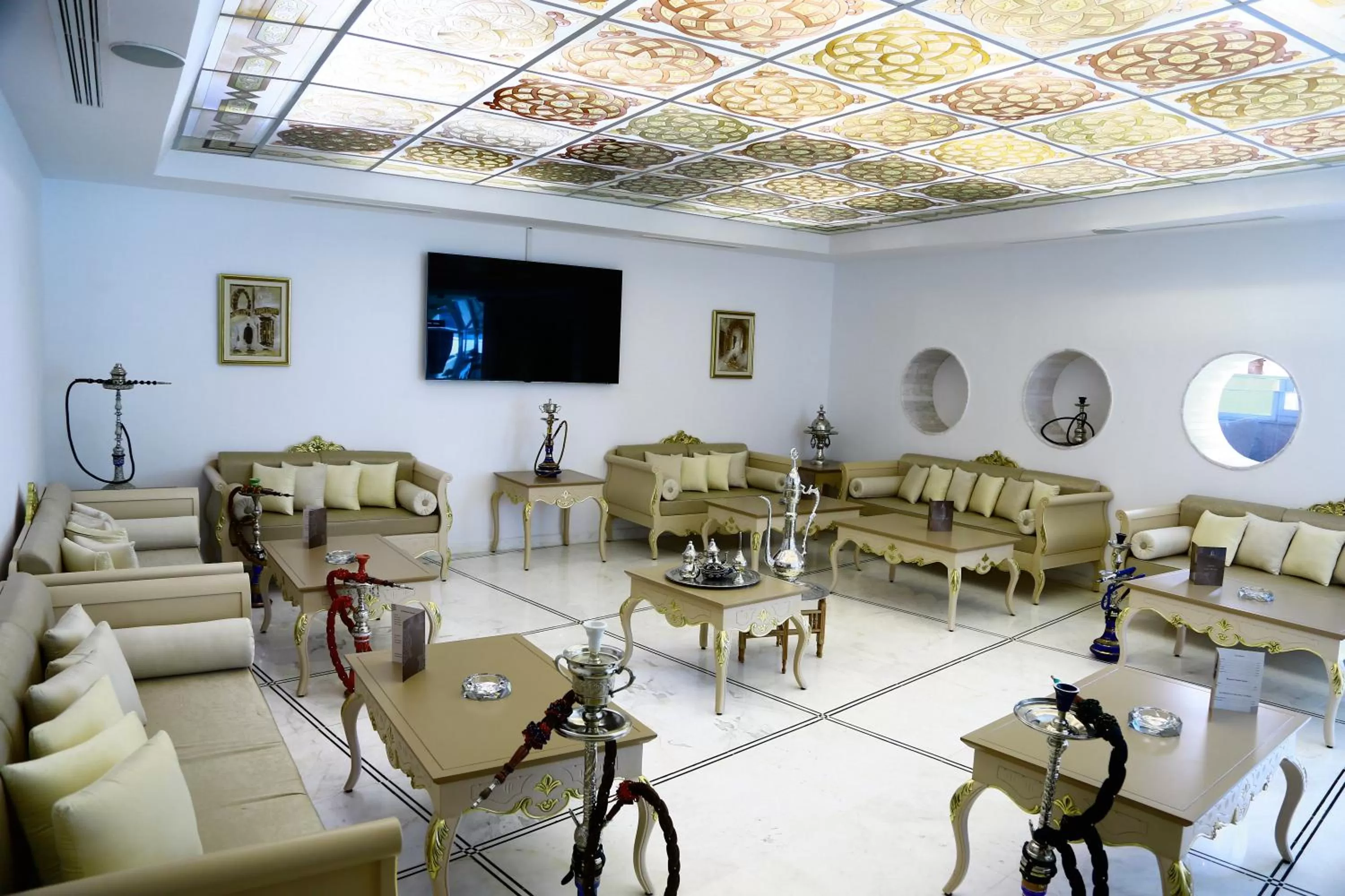 Communal lounge/ TV room in The Penthouse Suites Hotel