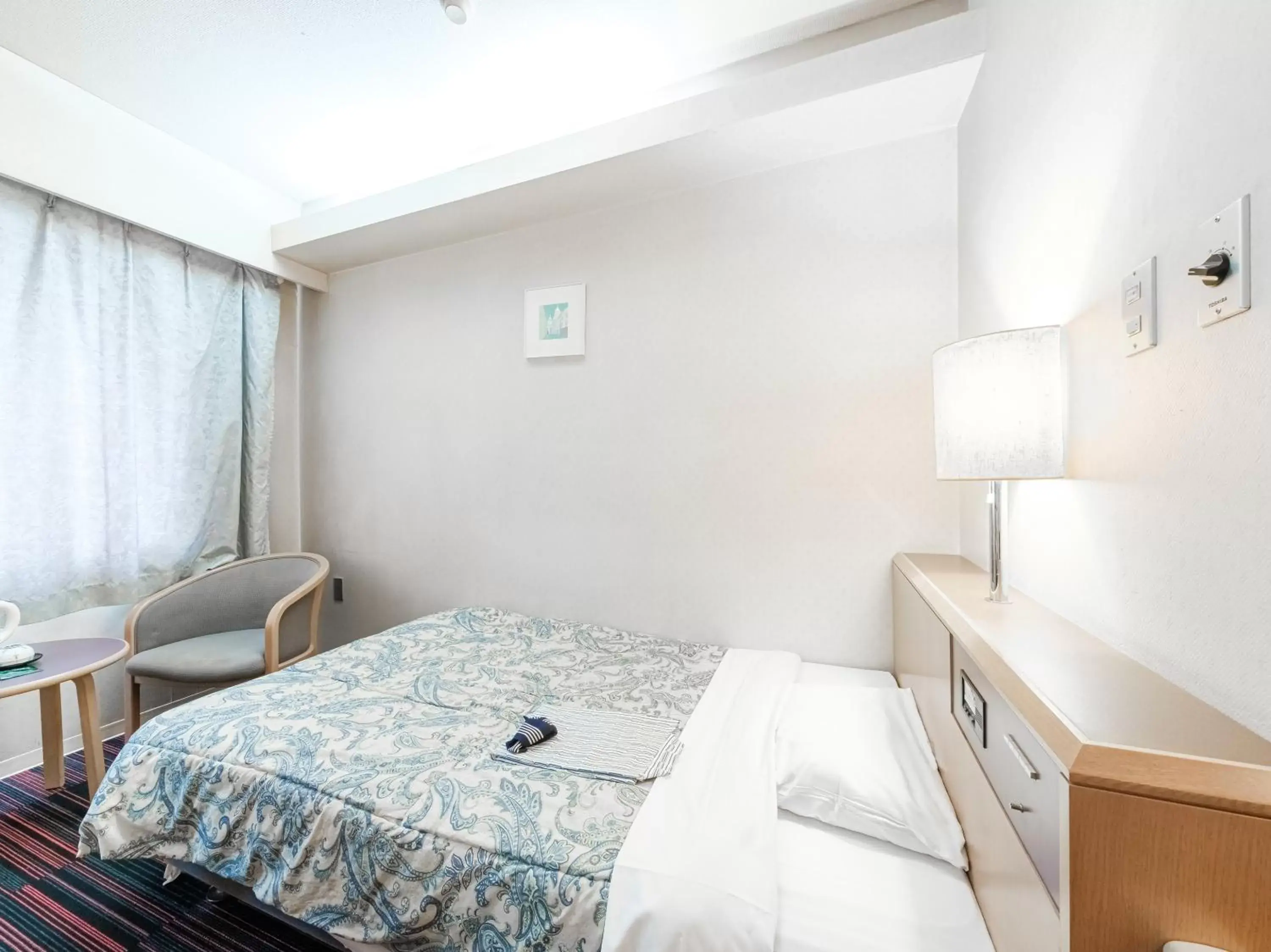 Bed in Hotel Tetora Spirit Sapporo