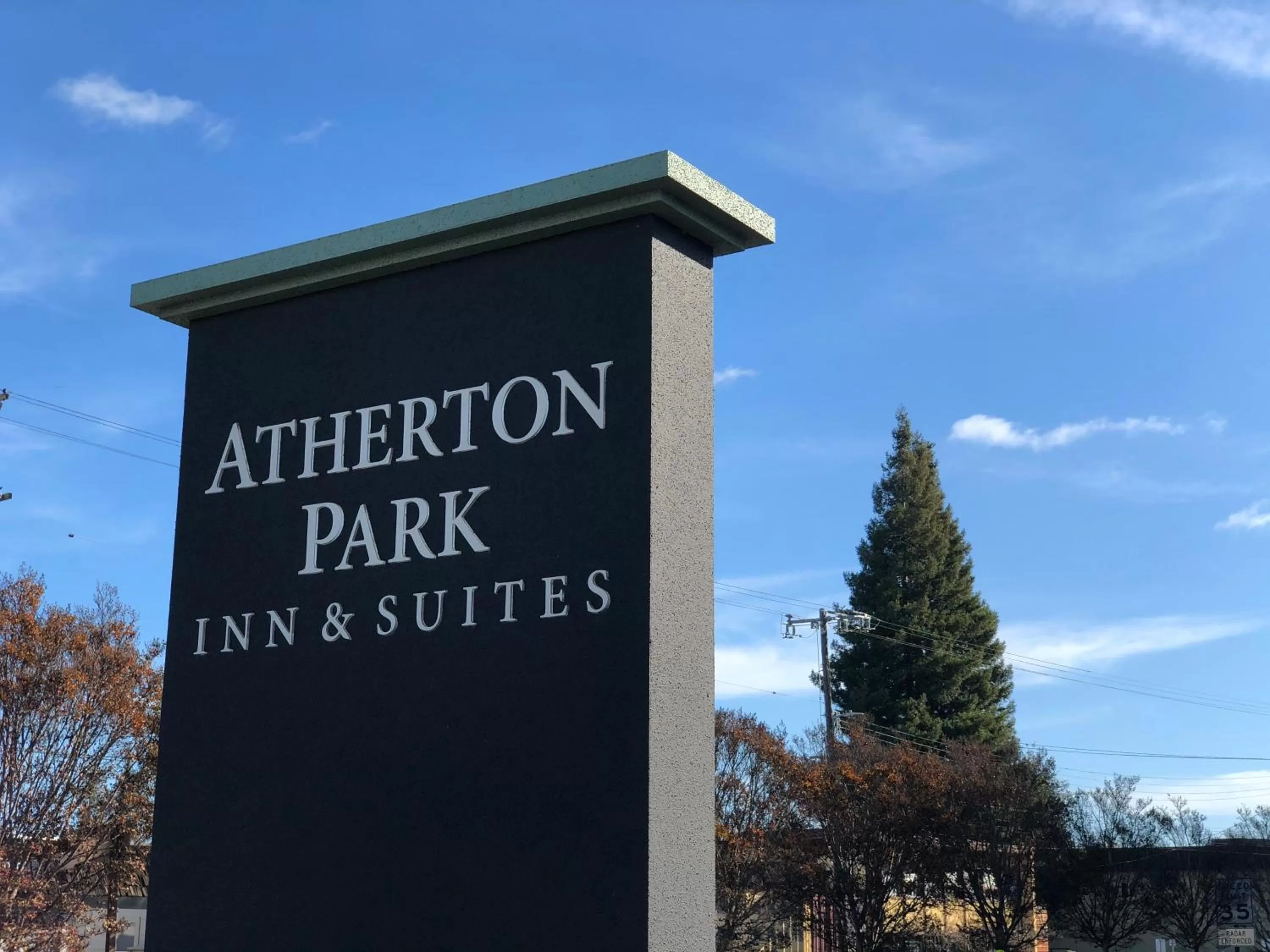 Property logo or sign in Atherton Park Inn and Suites