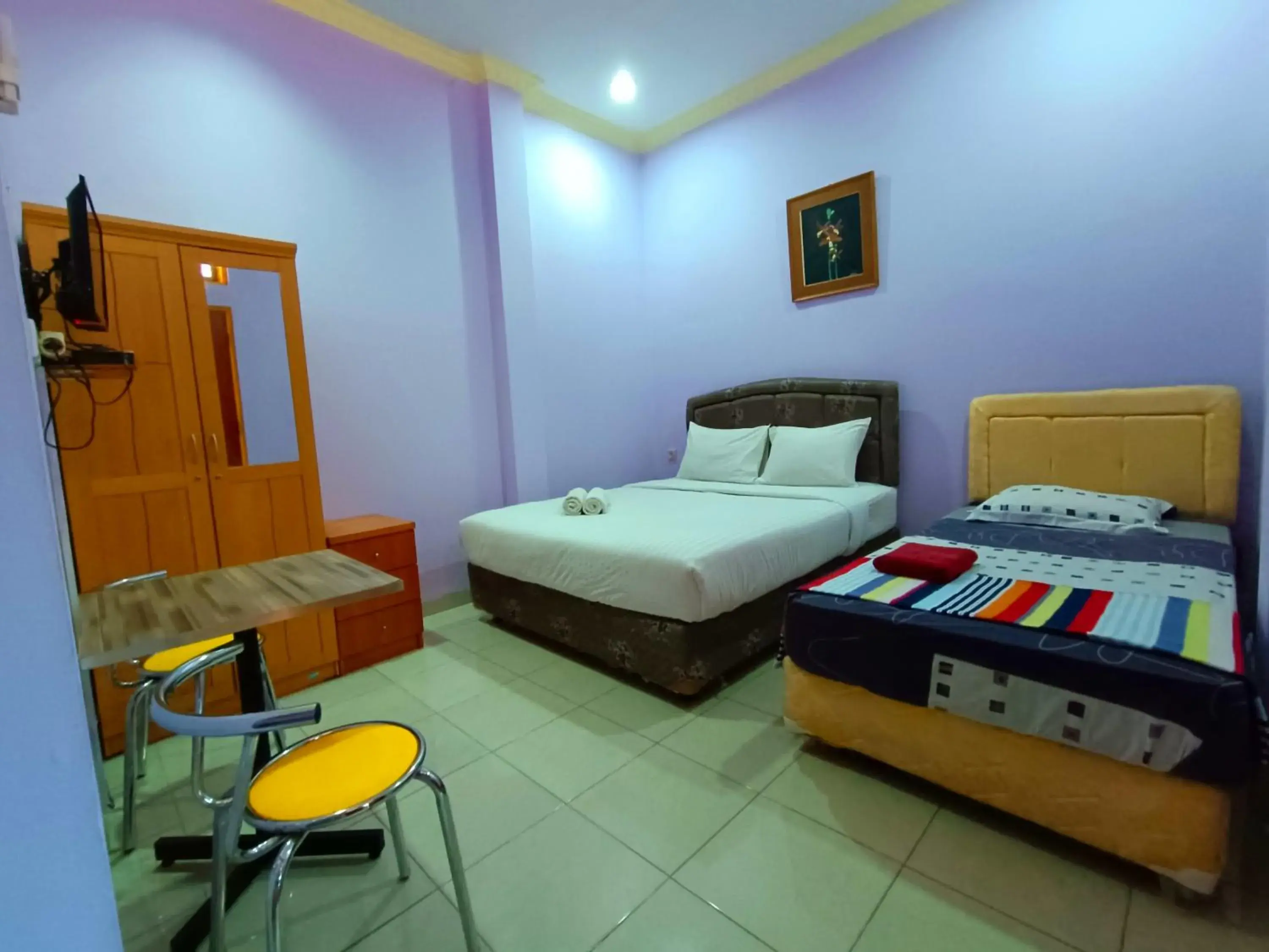Bed in Wisma Mutiara Hotel