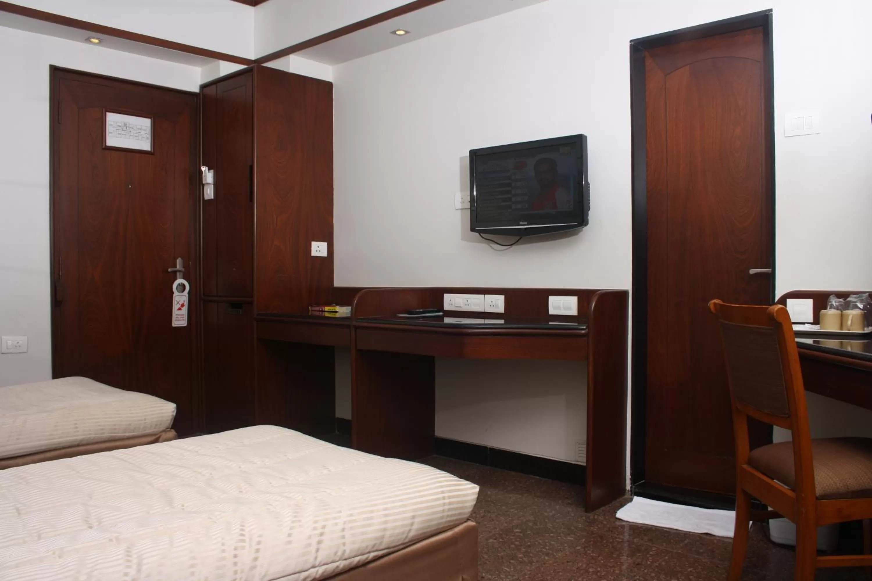 Bed in Hotel Karl Residency