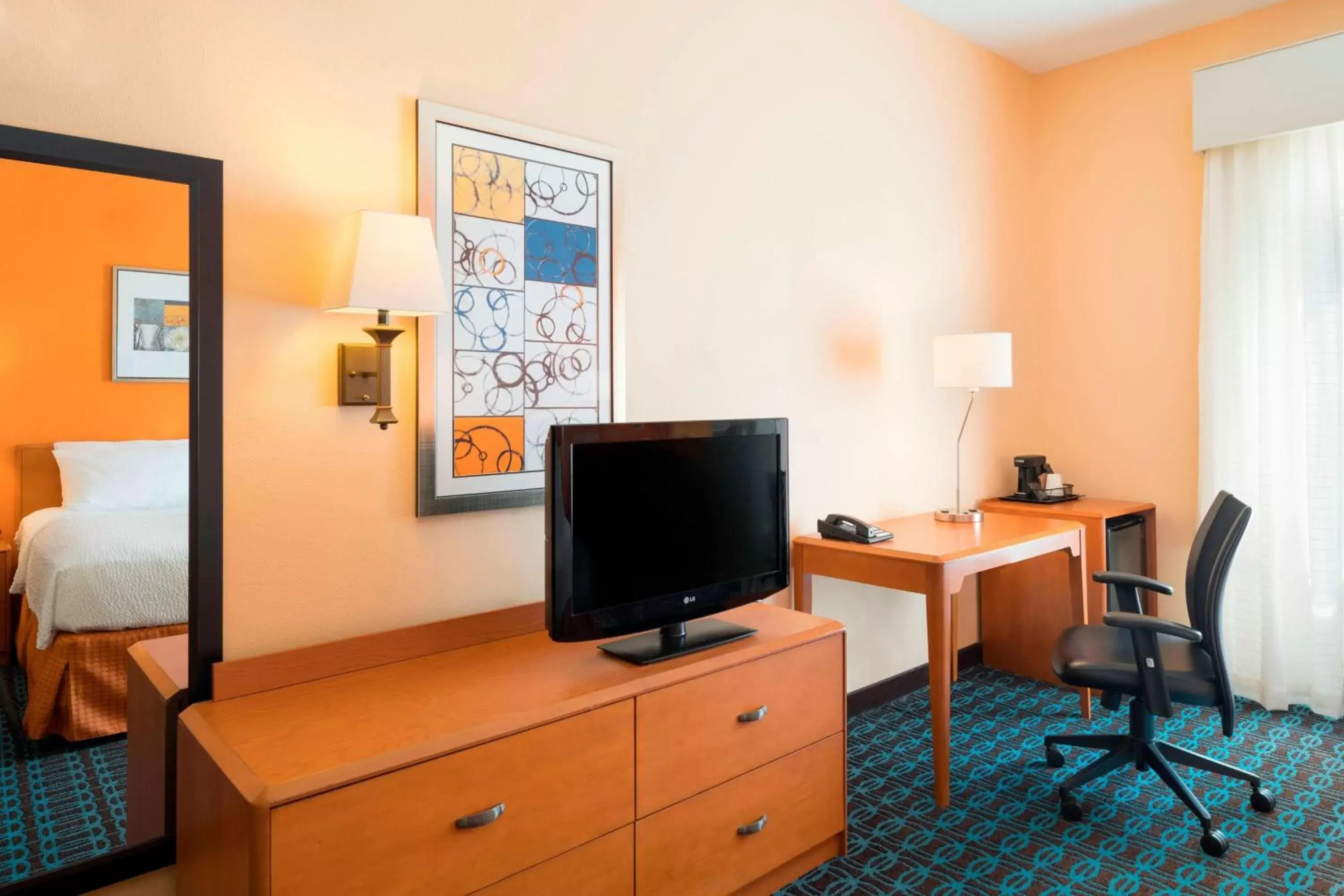 Photo of the whole room, TV/Entertainment Center in Fairfield Inn & Suites by Marriott State College