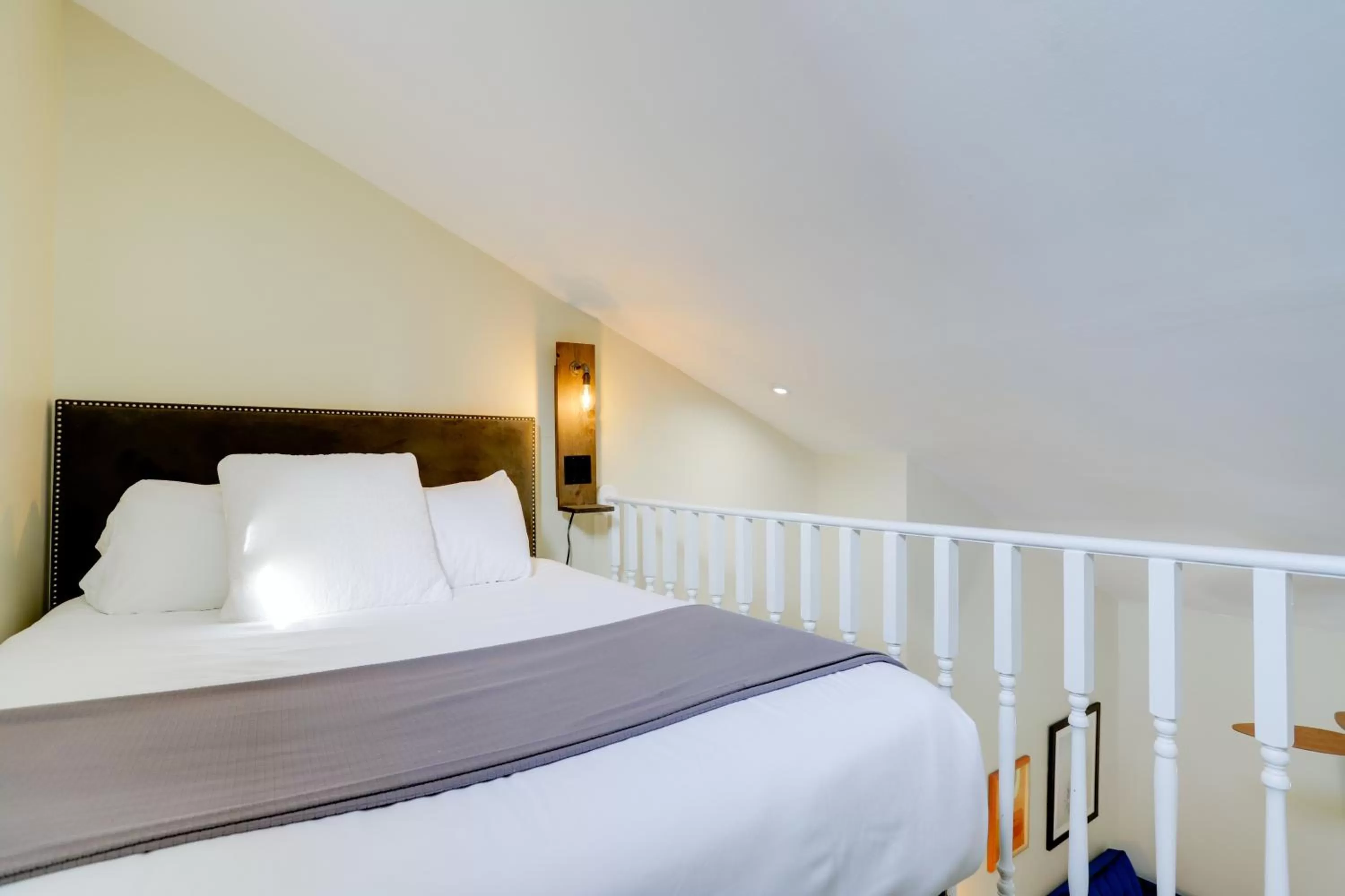 Bed in Sojourn at DuPont Place