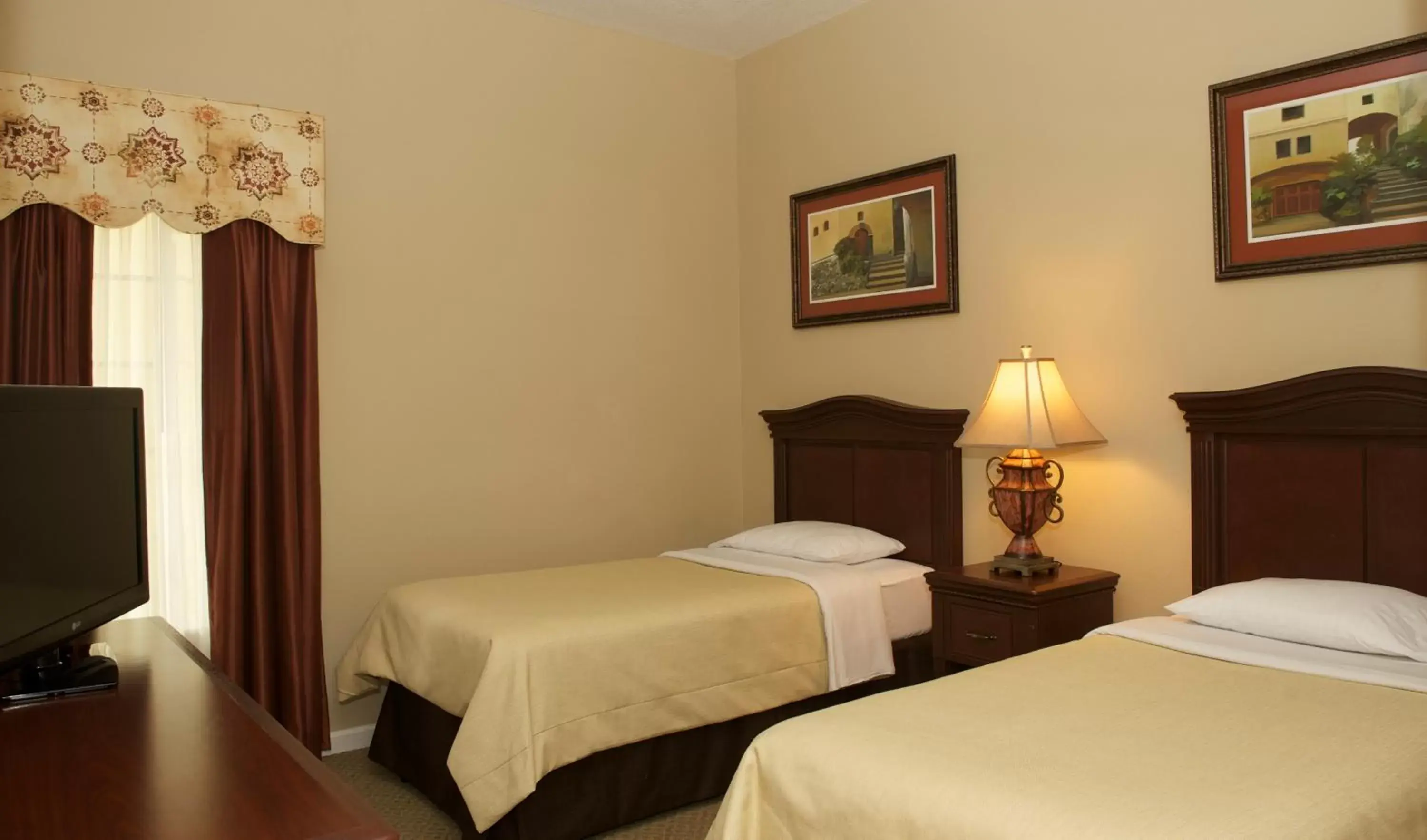 Photo of the whole room, Bed in WorldQuest Orlando Resort