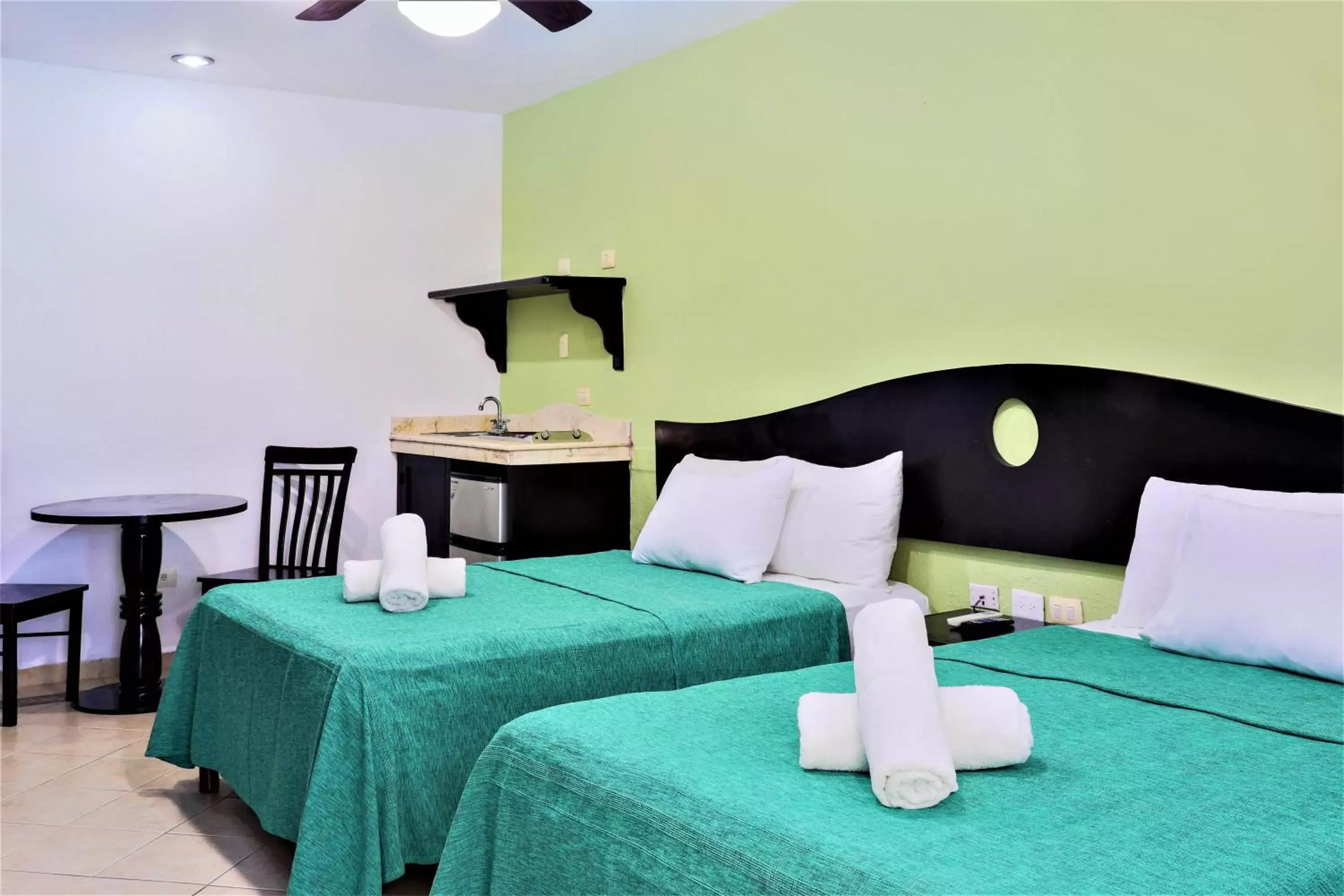 Photo of the whole room, Bed in Hotel Colonial Playa del Carmen