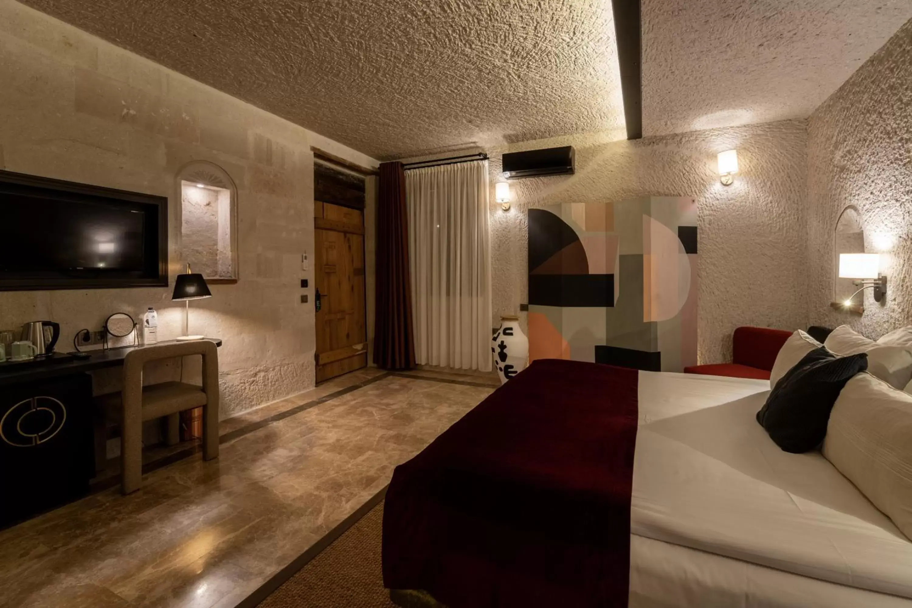 Bedroom, Bed in Artemis Cave Suites & Spa- Adults Only