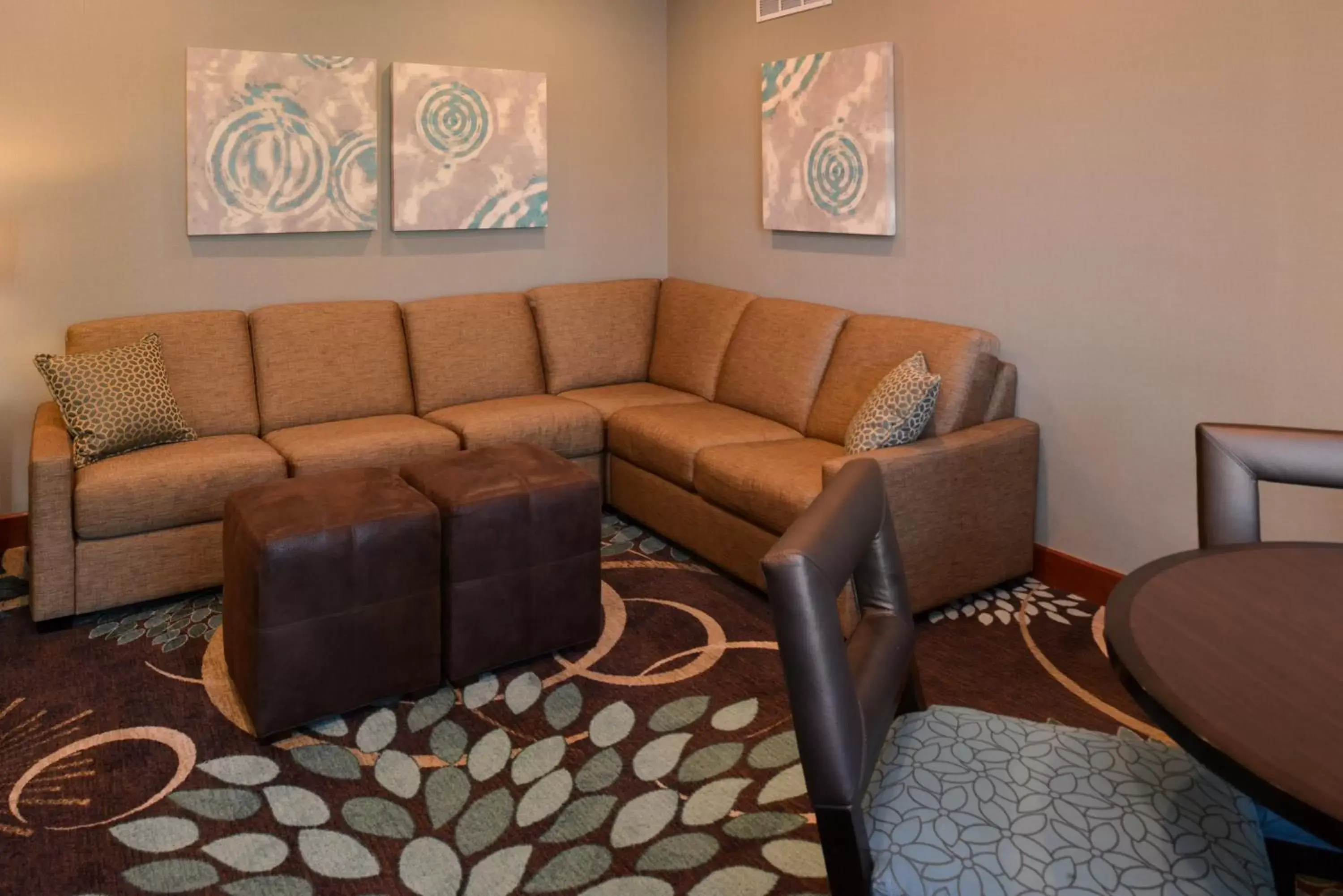 Property building, Seating Area in Staybridge Suites Sioux Falls at Empire Mall, an IHG Hotel