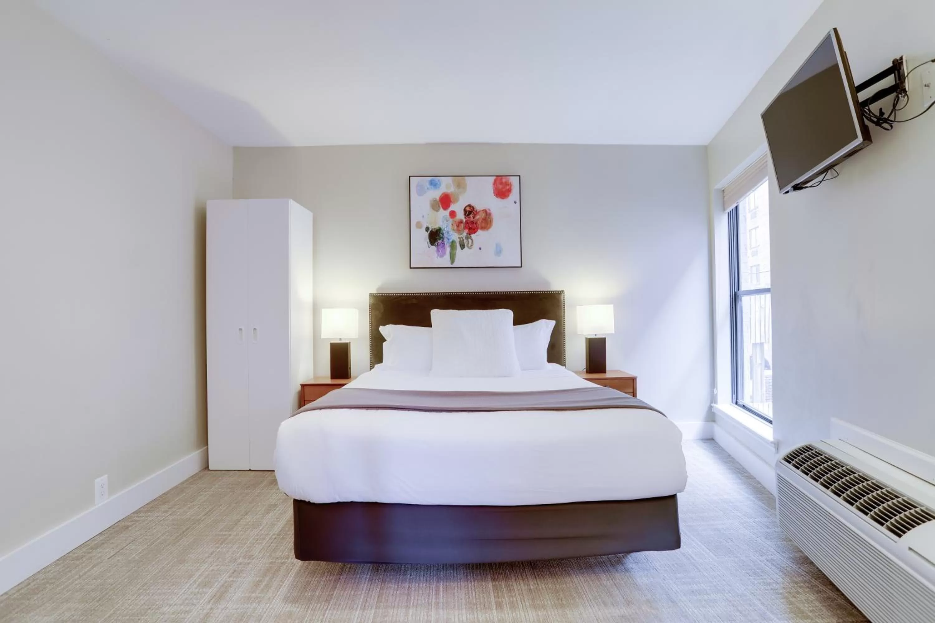 Bed in Sojourn at DuPont Place