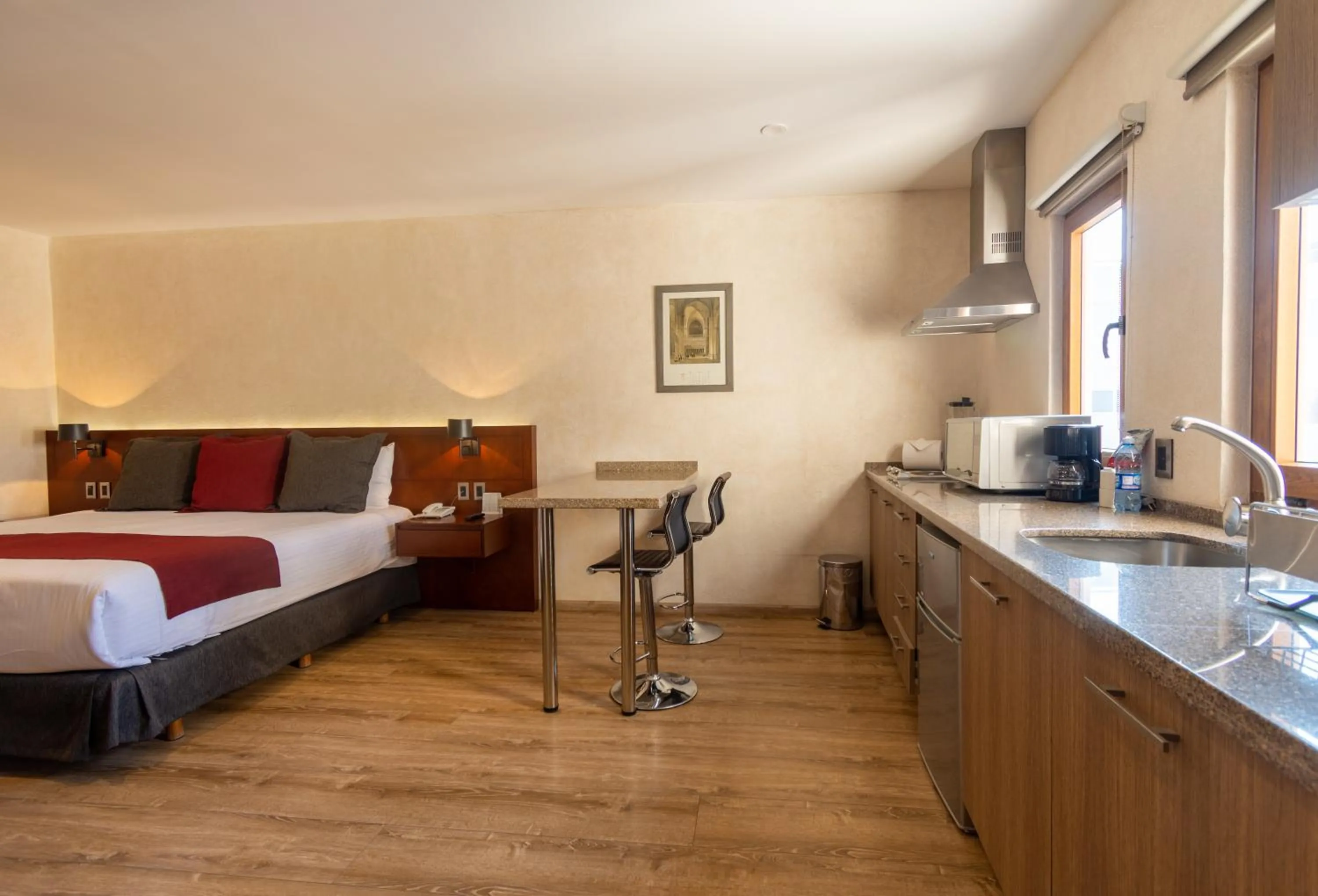 Kitchen or kitchenette, Bed in Hotel Madero