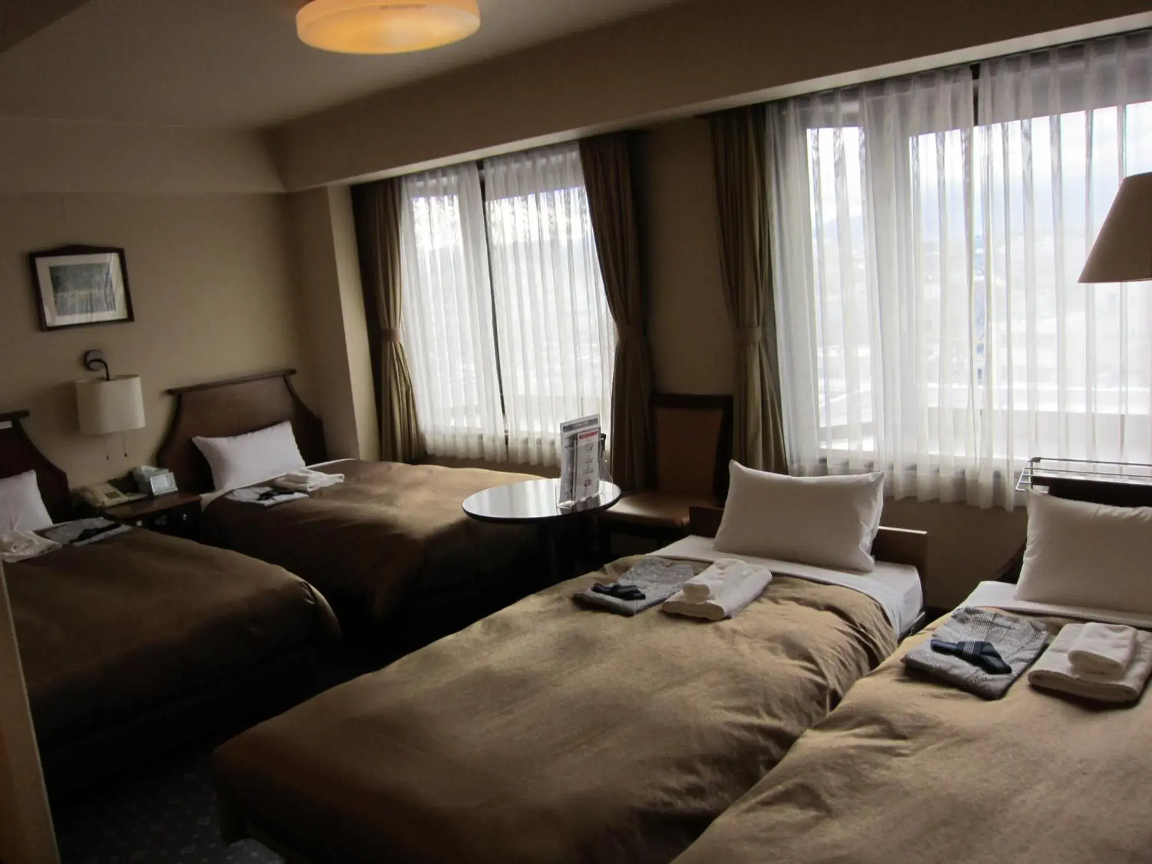 Photo of the whole room, Bed in Hotel New Station