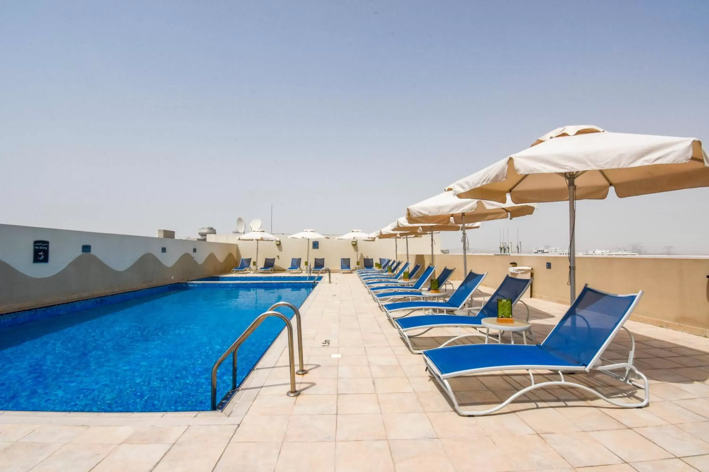 Day, Swimming Pool in Premier Inn Dubai Investments Park