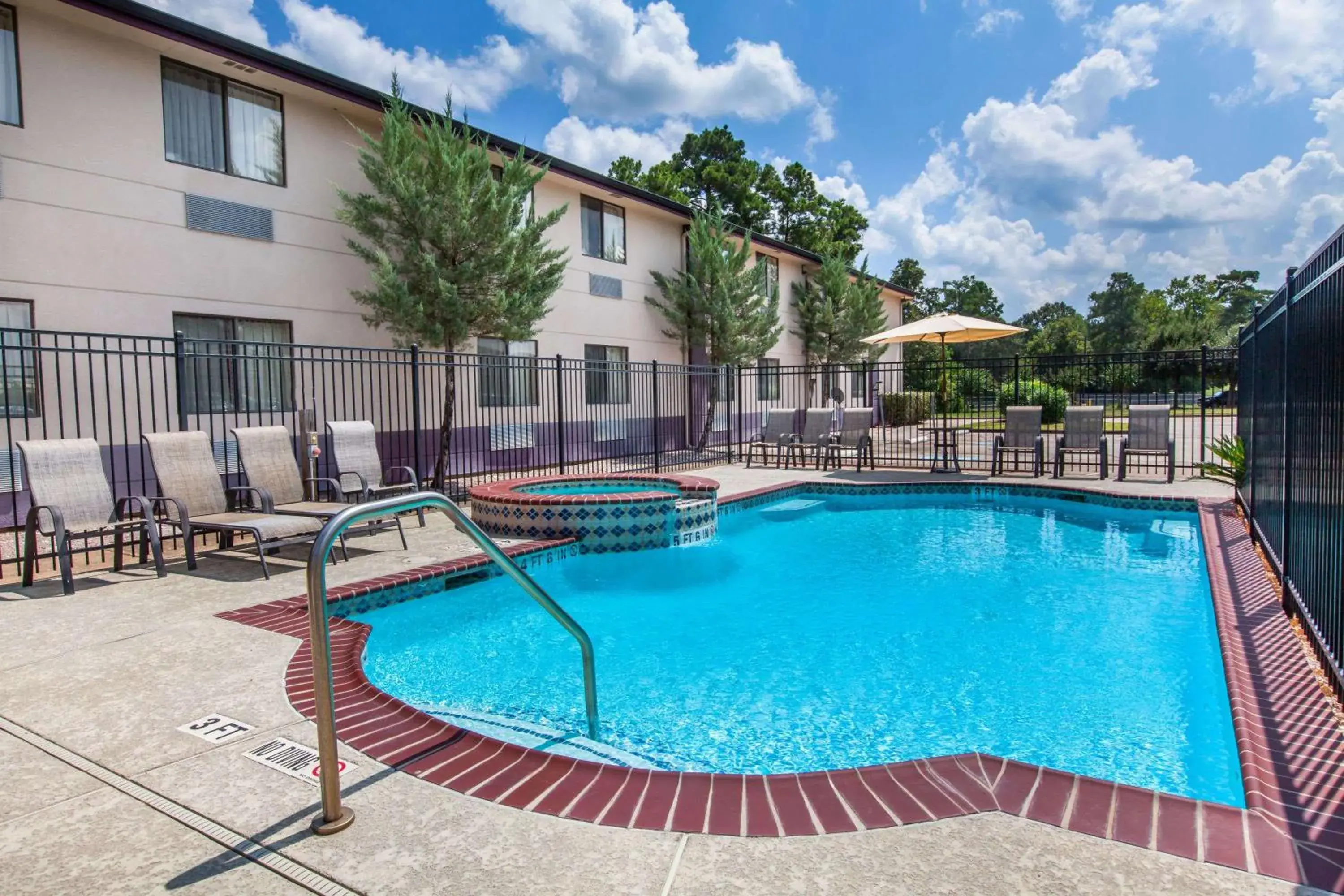 On site, Swimming Pool in Super 8 by Wyndham Cleveland TX