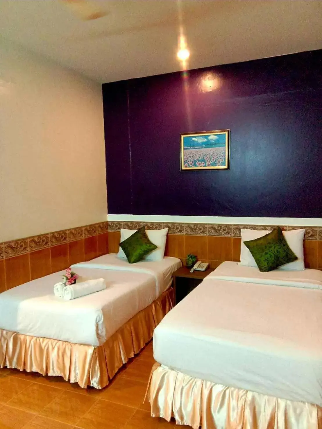 Photo of the whole room, Bed in Suriwong Chumphon Hotel