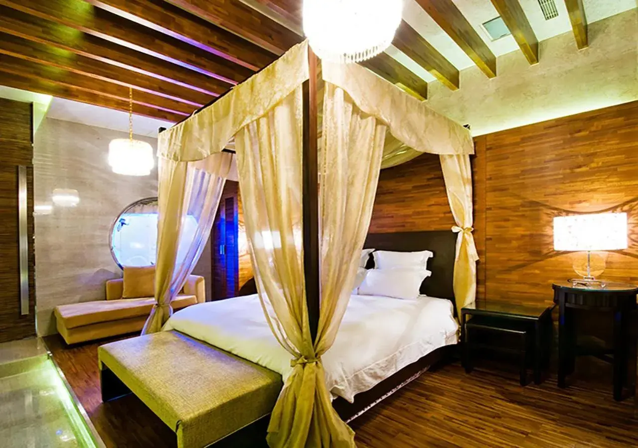 Bed in Royal Group Motel Ming Zu Branch