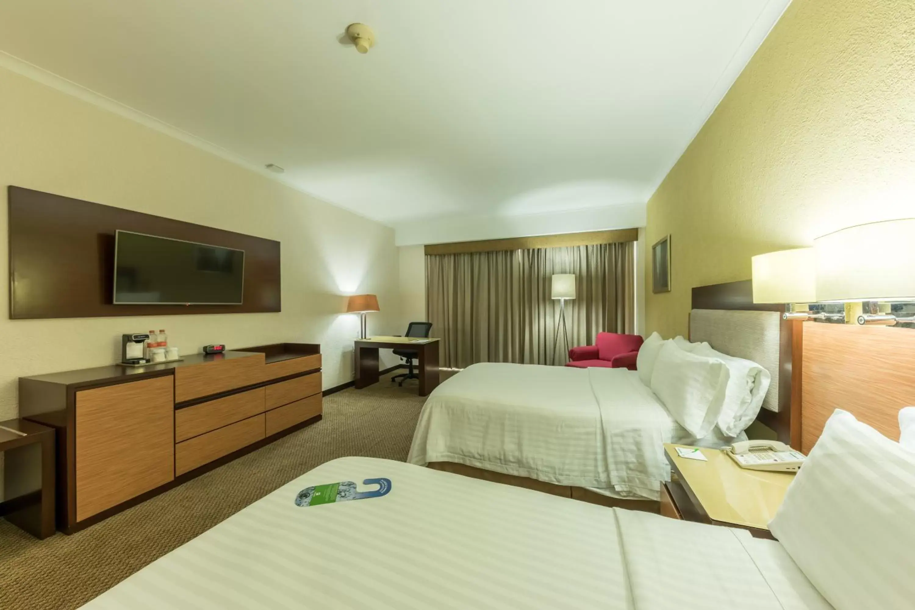 Bedroom in Holiday Inn Guadalajara Select, an IHG Hotel