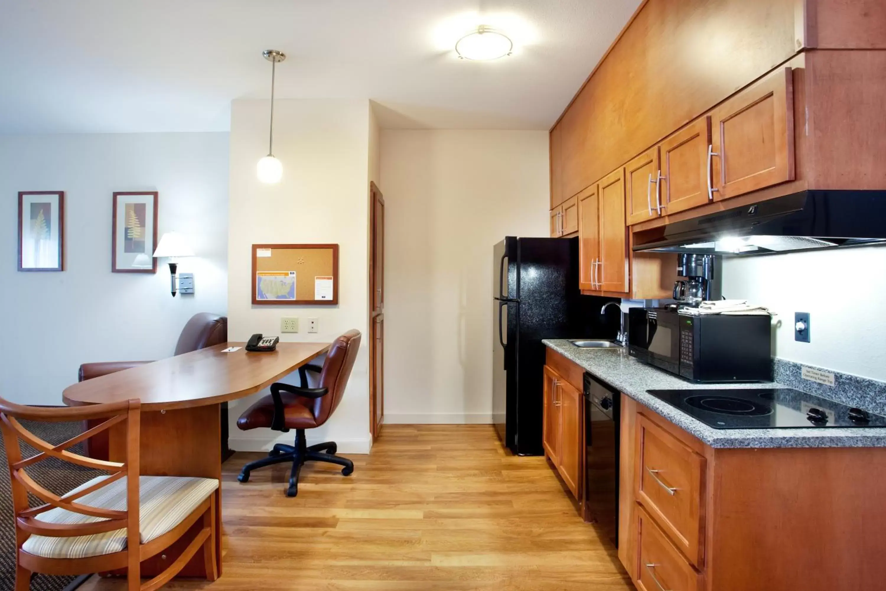 Photo of the whole room, Kitchen/Kitchenette in Candlewood Suites New Iberia, an IHG Hotel