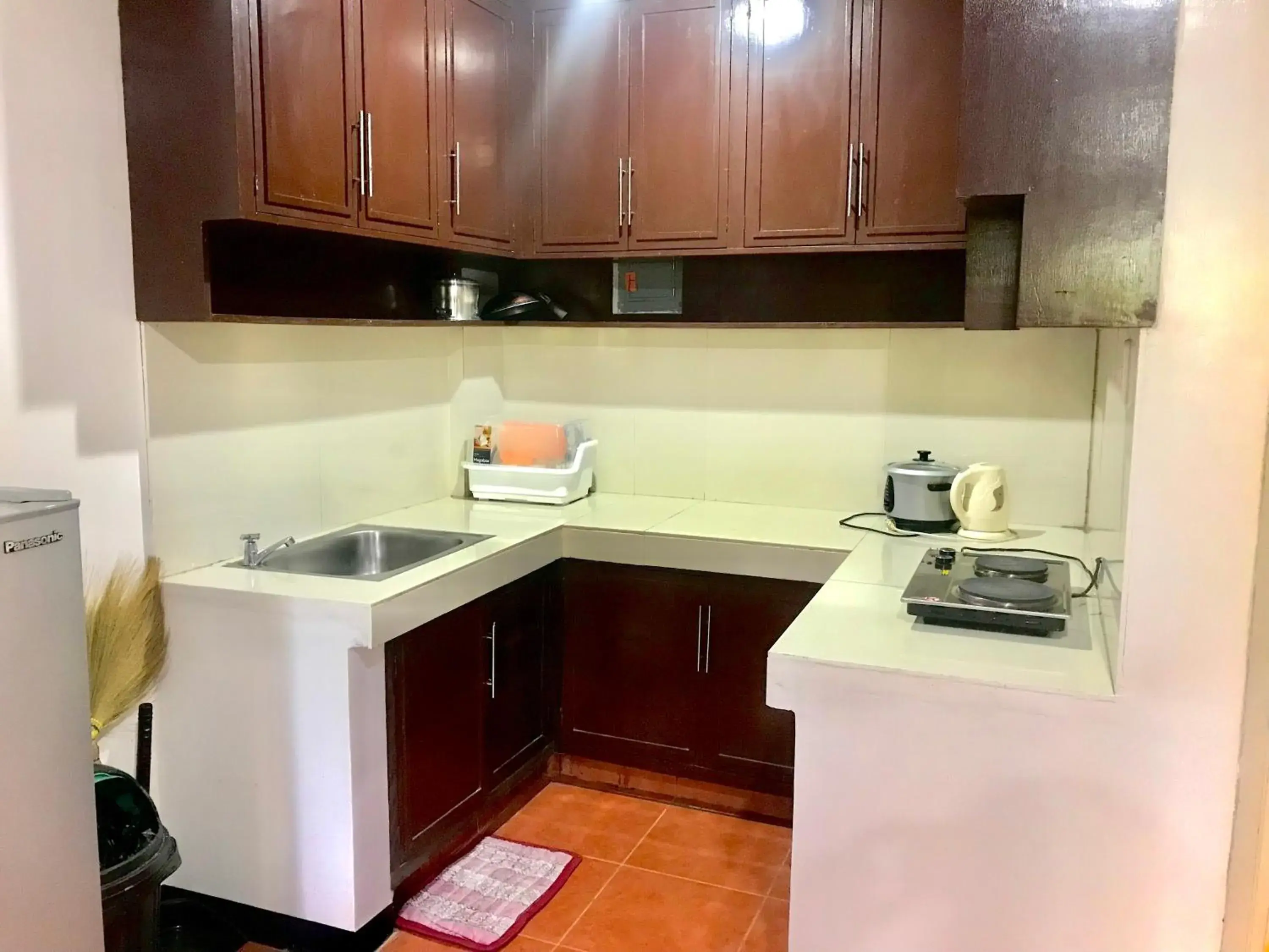 kitchen, Kitchen/Kitchenette in Badladz Staycation Condos