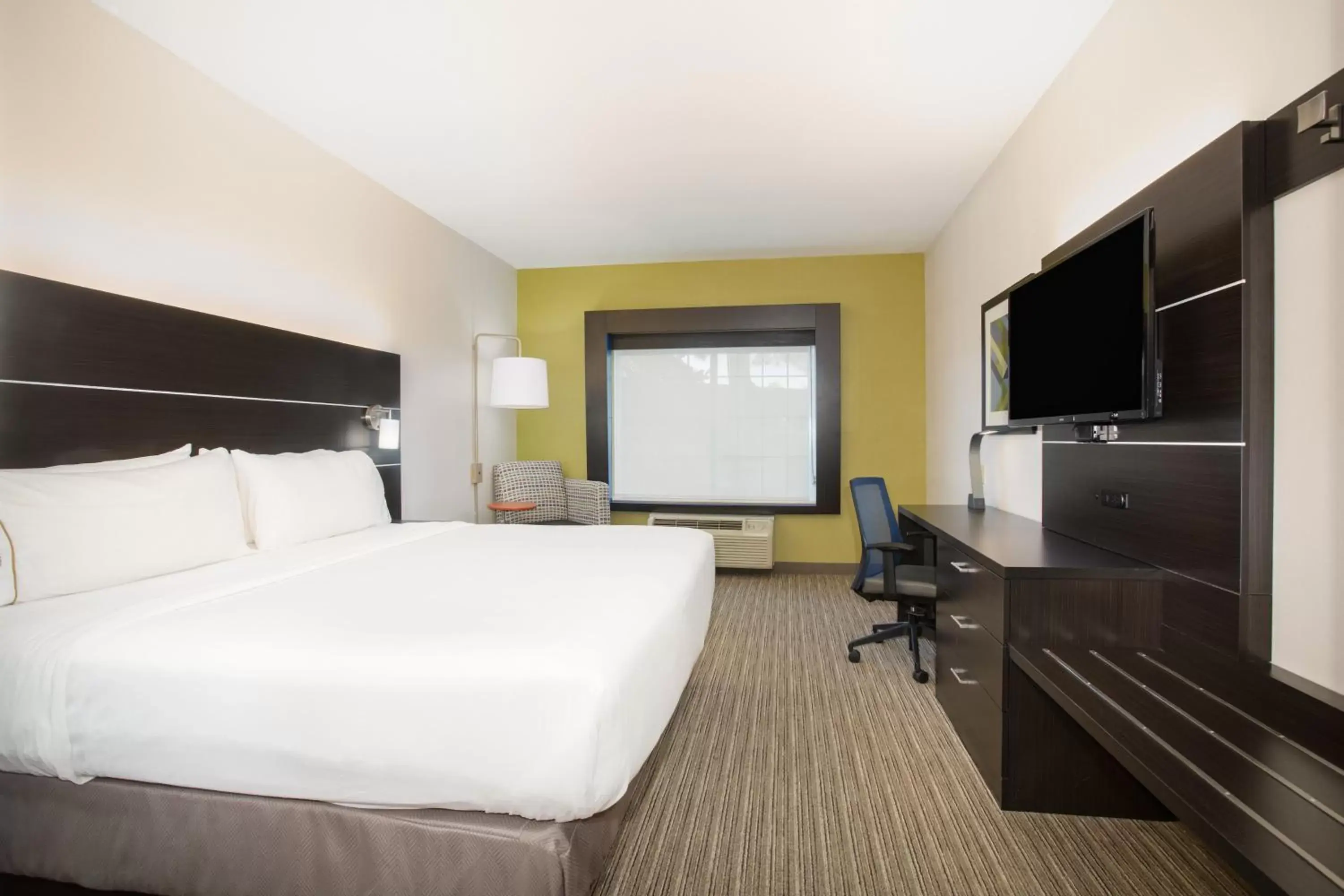 Photo of the whole room, TV/Entertainment Center in Holiday Inn Express Hotel & Suites Fort Collins, an IHG Hotel