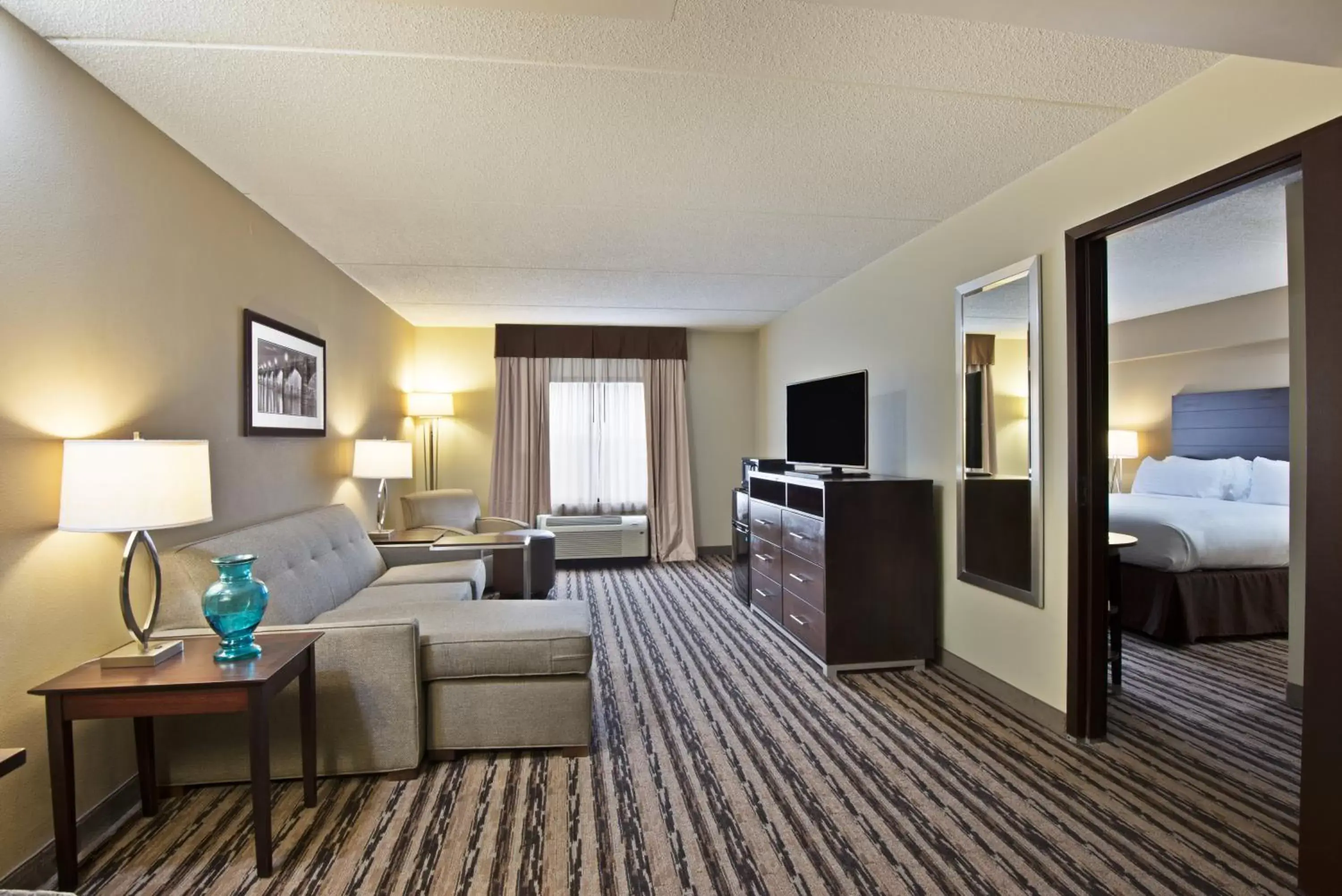 Bedroom, Seating Area in Holiday Inn Harrisburg East, an IHG Hotel