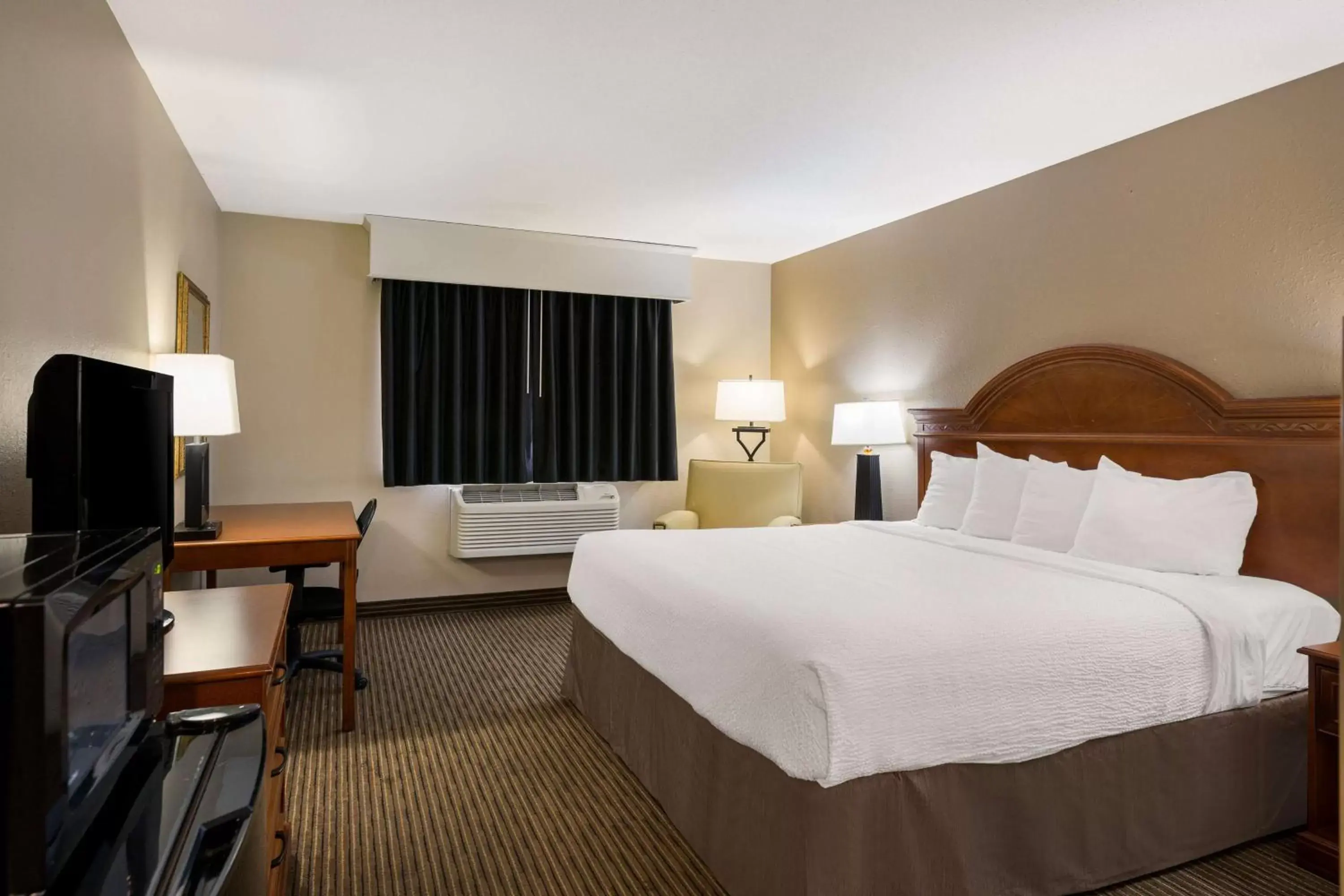 Bedroom, Bed in Revel Hotel Minot - SureStay Collection by Best Western