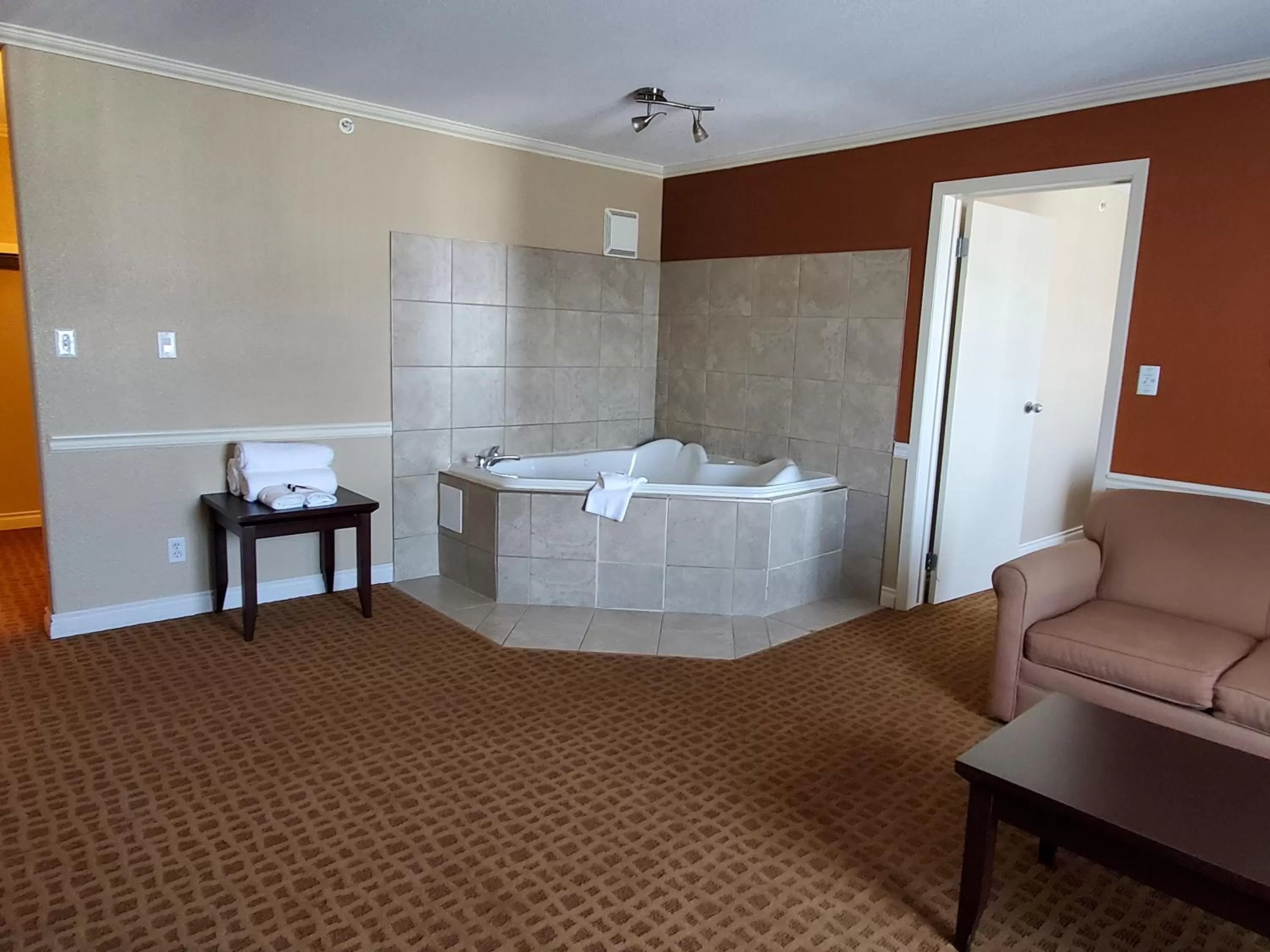 Living room, Bed in Super 8 by Wyndham Edmonton International Airport