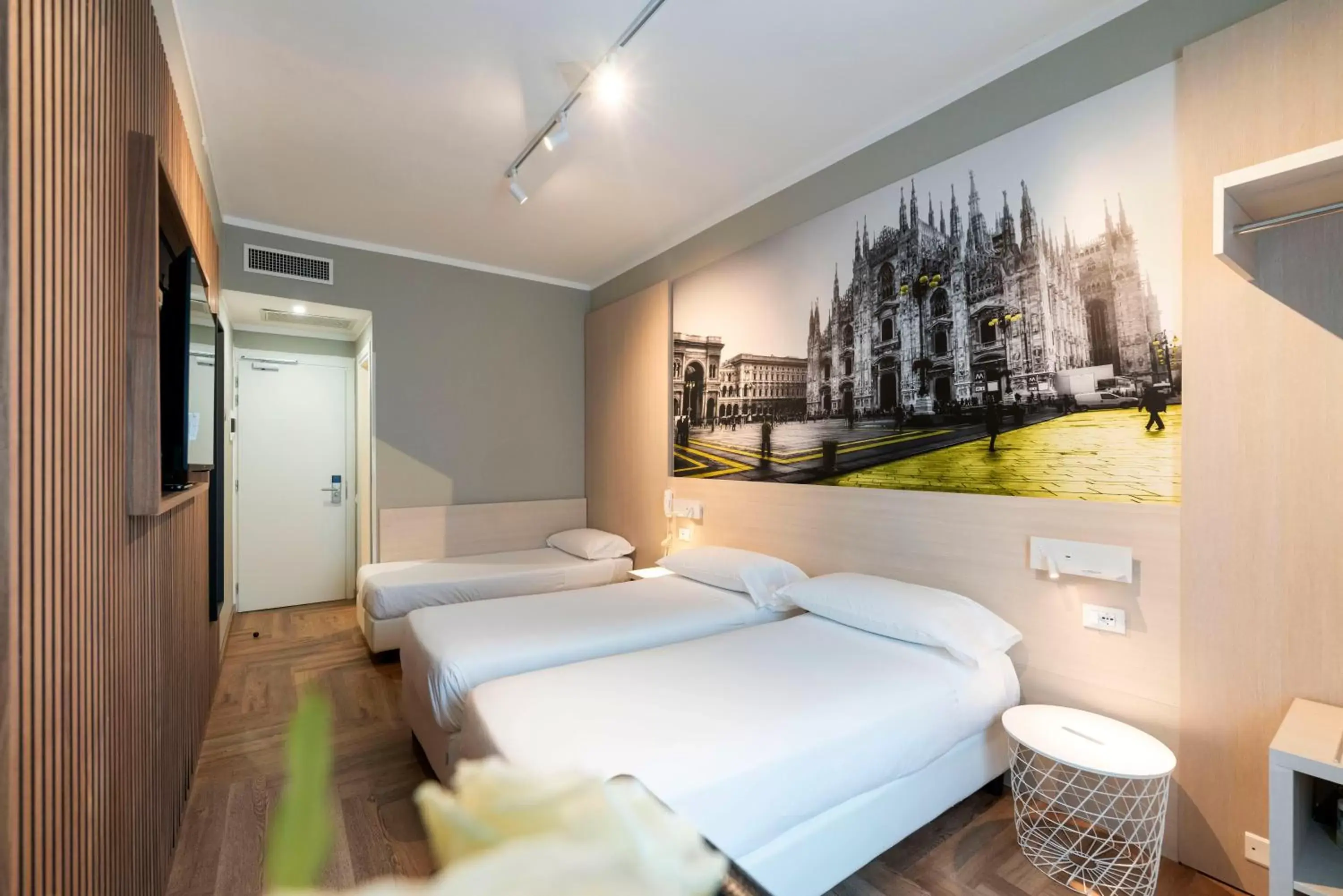 Bed in Kleos Hotel Milano