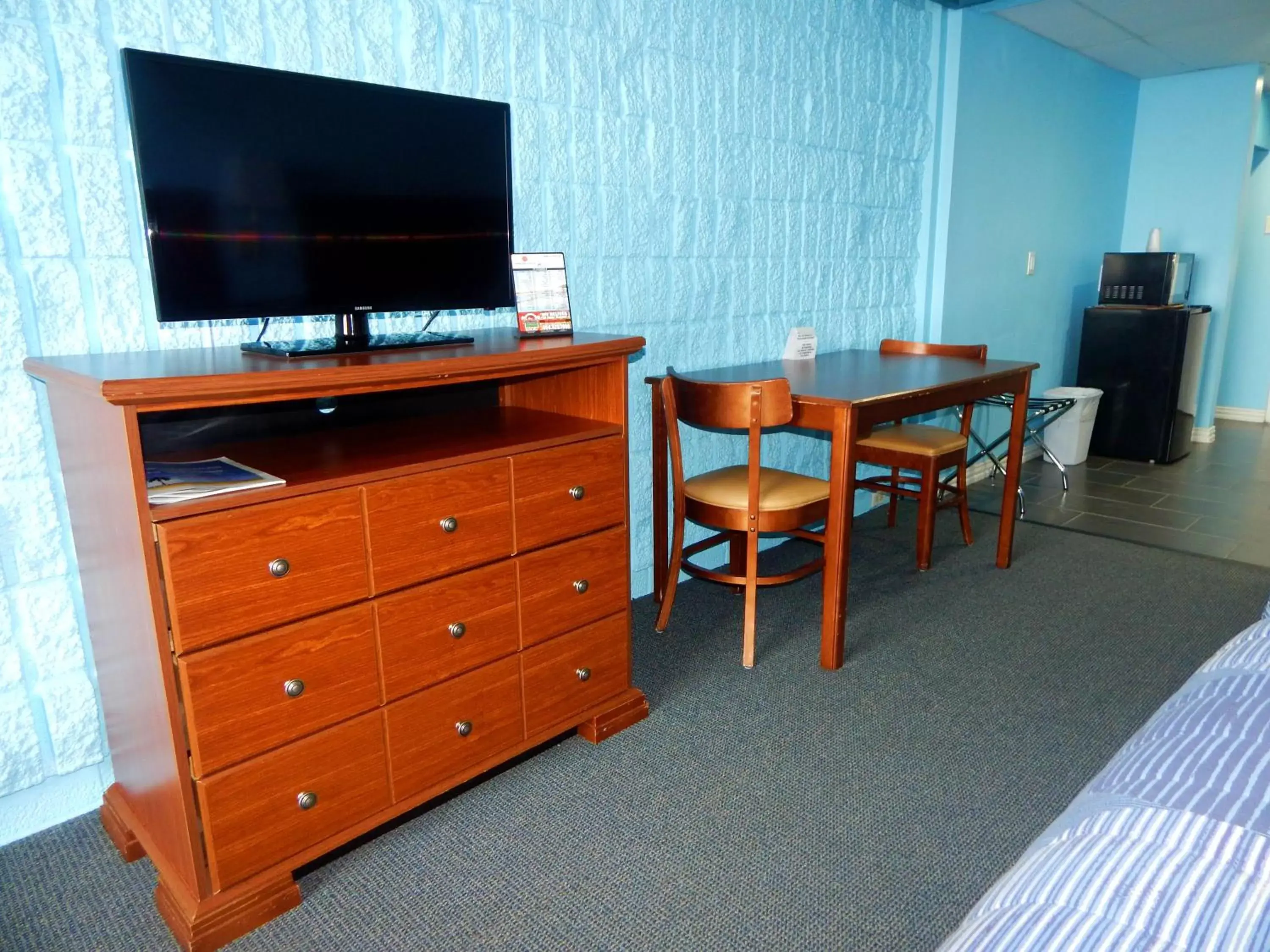 Photo of the whole room, TV/Entertainment Center in Padre South Hotel On The Beach