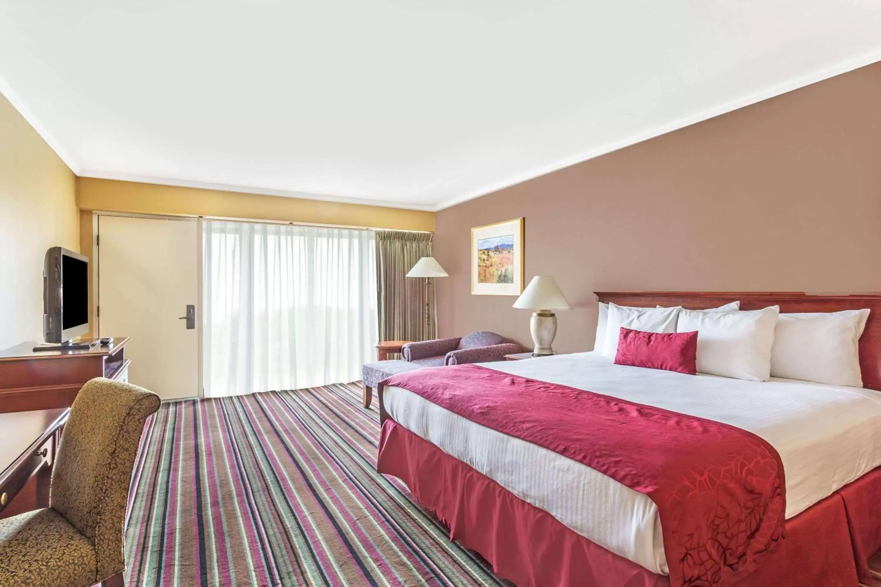 Photo of the whole room, Bed in Days Inn & Suites by Wyndham Logan
