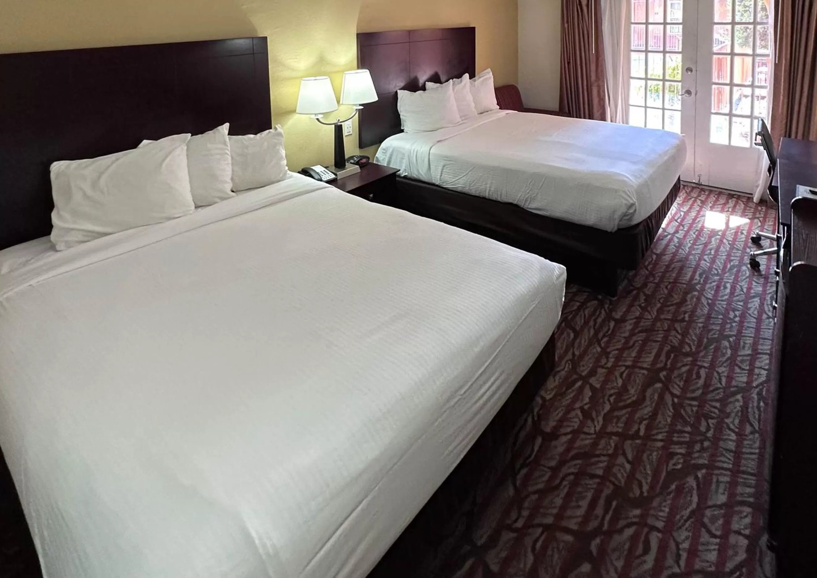 Bed in Studio 6 Suites Dallas TX Downtown