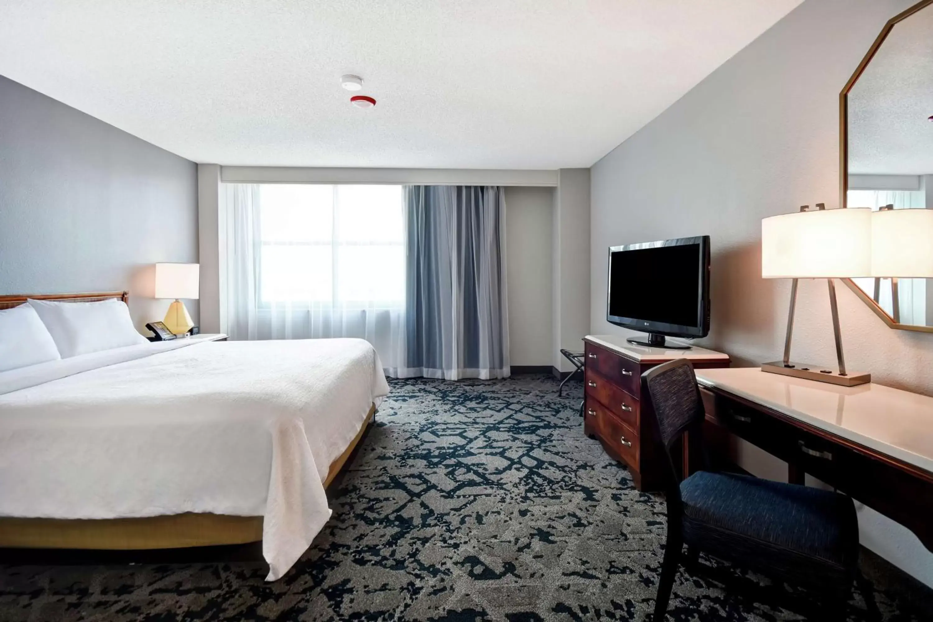 Bedroom, TV/Entertainment Center in Embassy Suites Montgomery - Hotel & Conference Center