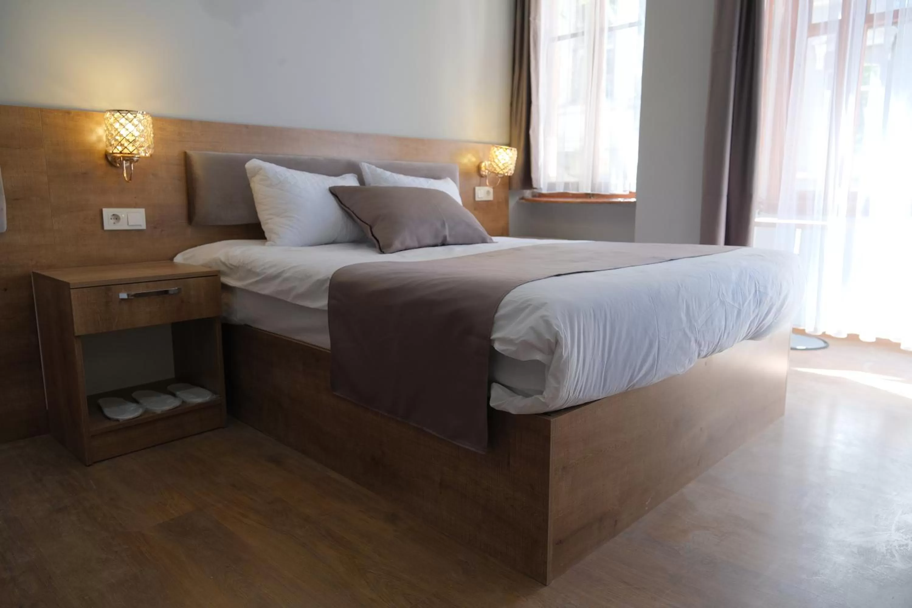 Bed in Adamantides Hotel