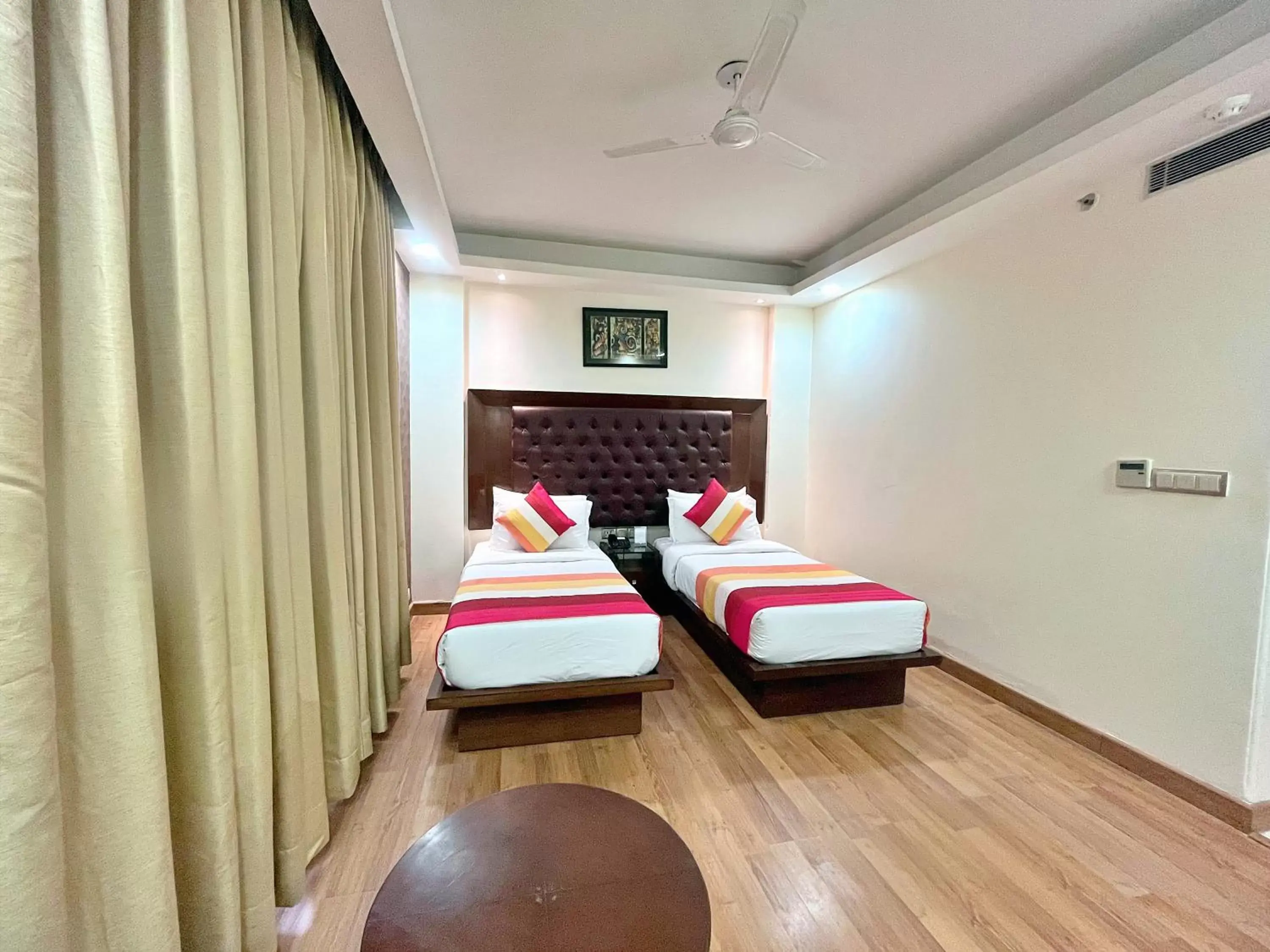 Bed in The Grand Orion - Kailash Colony