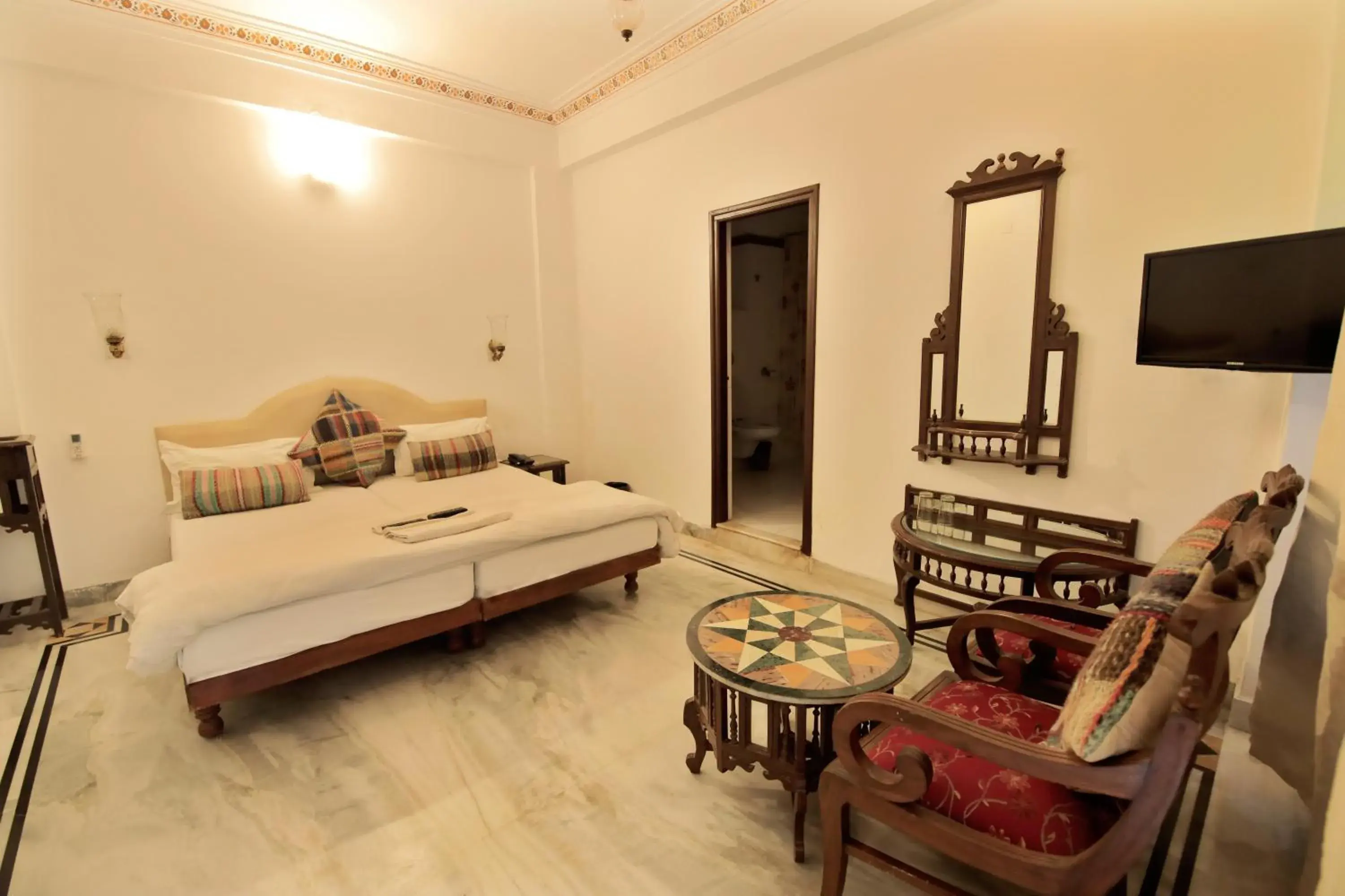Bedroom in Hotel Devraj Niwas on Lake Pichola Udaipur