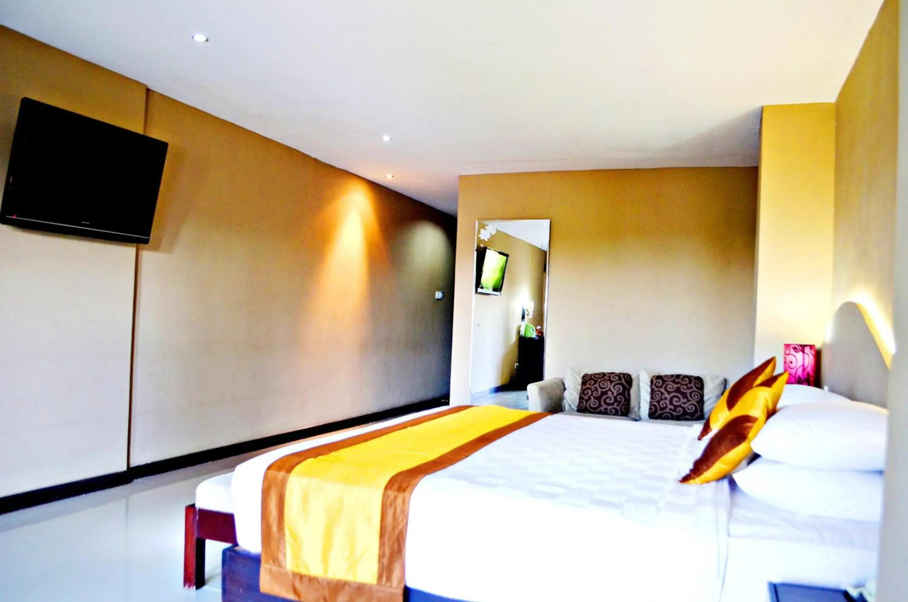 Bed in Nirmala Hotel & Convention Centre
