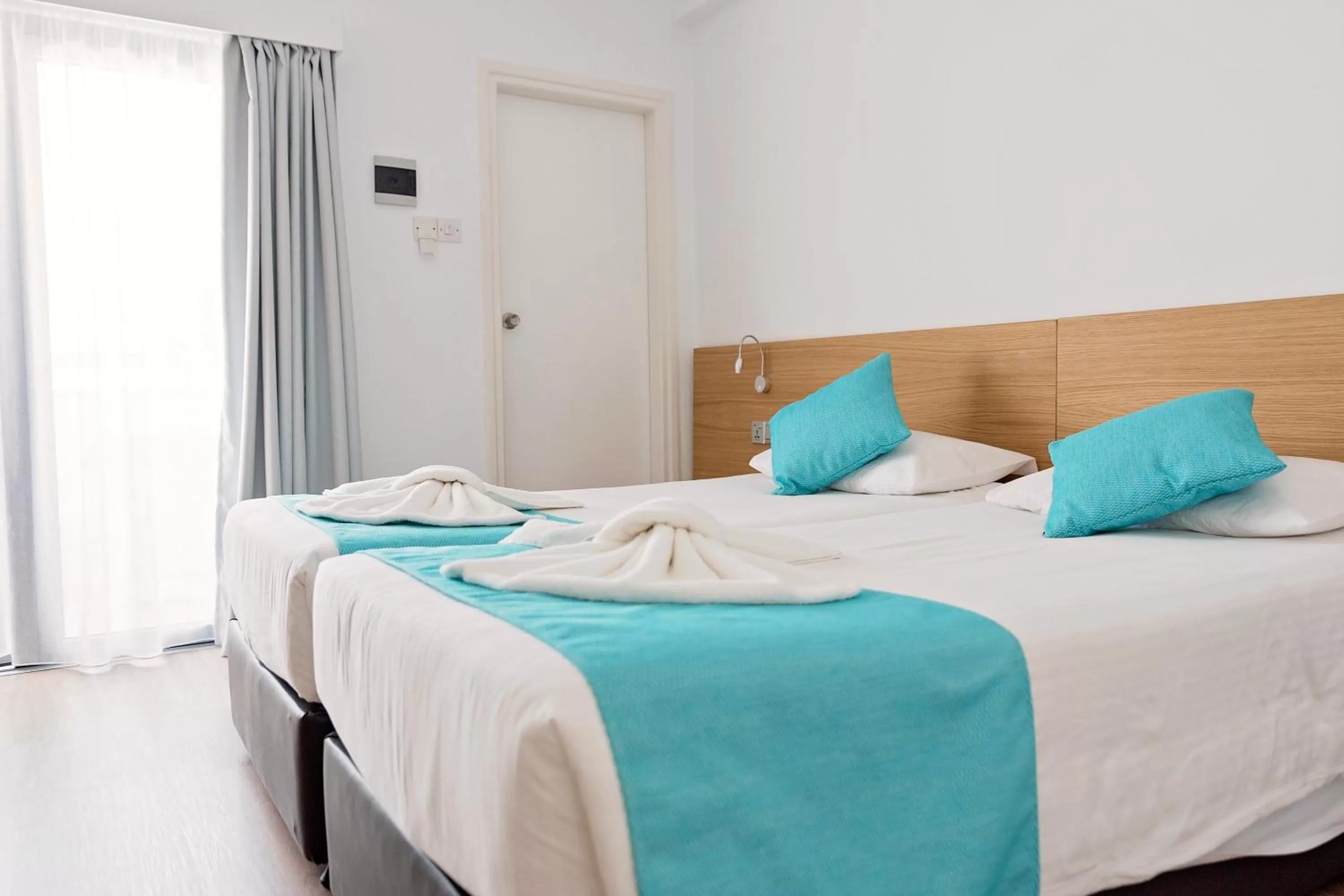 Bed in Pyramos Hotel