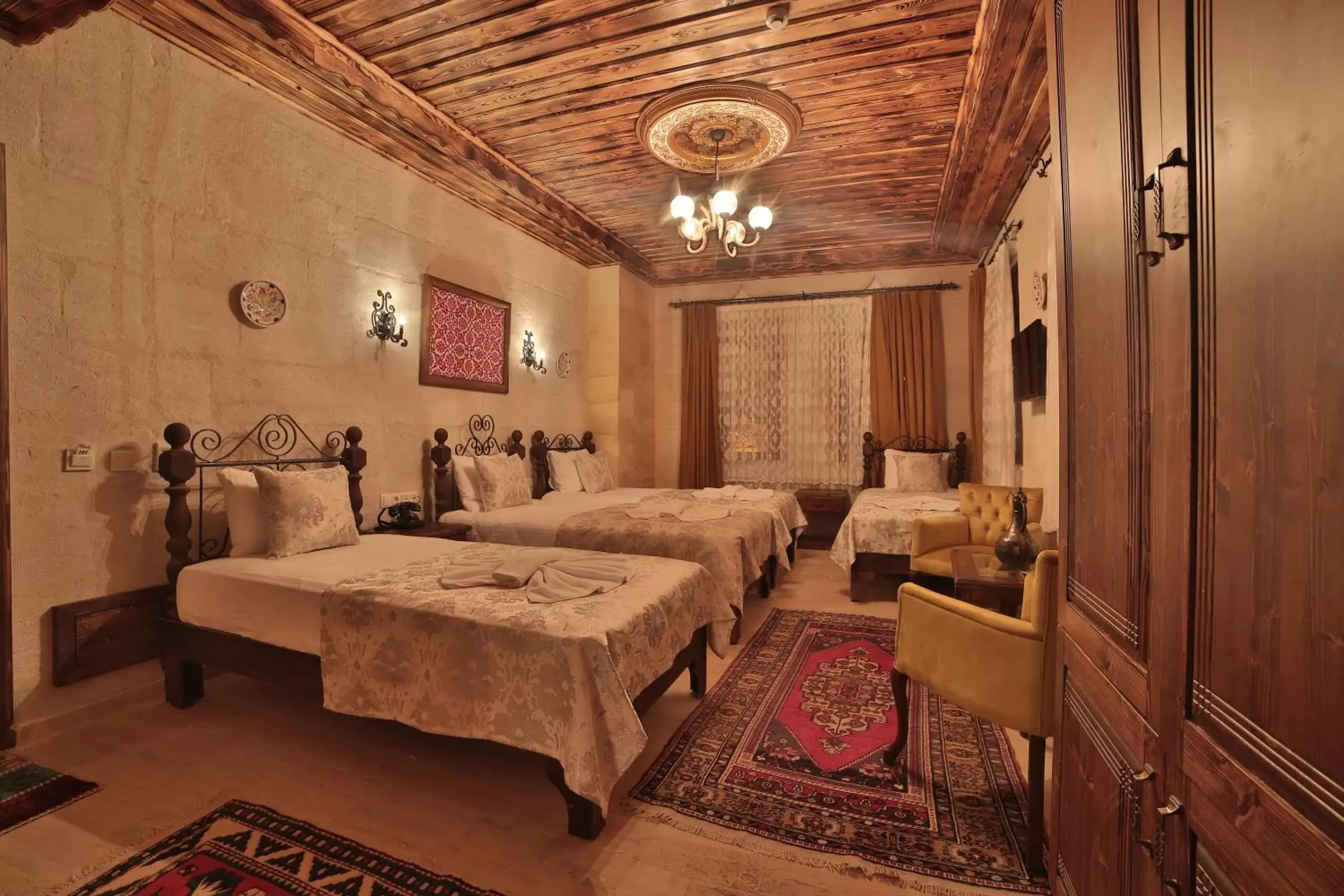 Bed in Caravanserai Inn Hotel