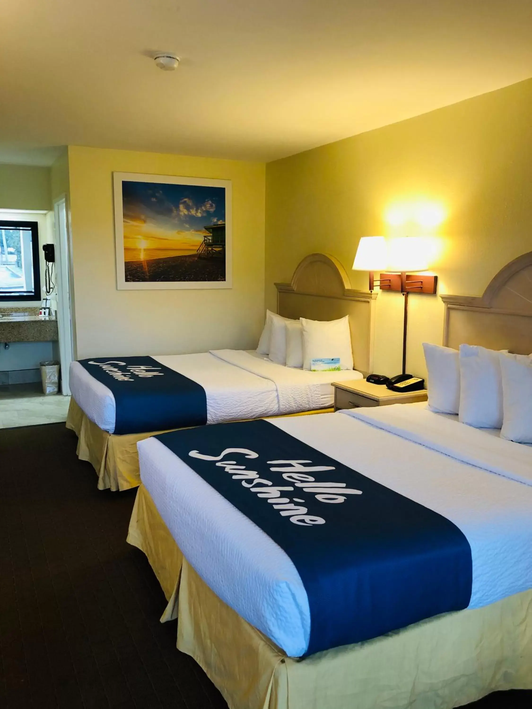 Bed in Days Inn & Suites by Wyndham Navarre Conference Center