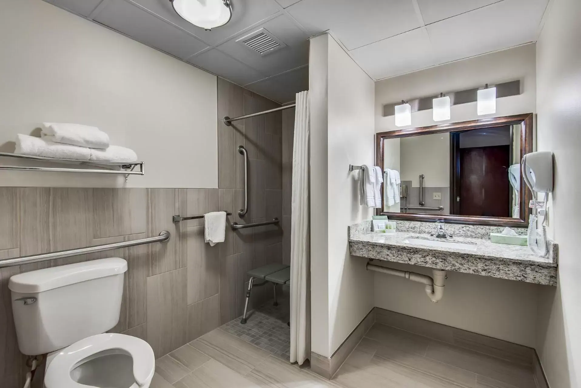 Bathroom in AmericInn by Wyndham Coon Rapids