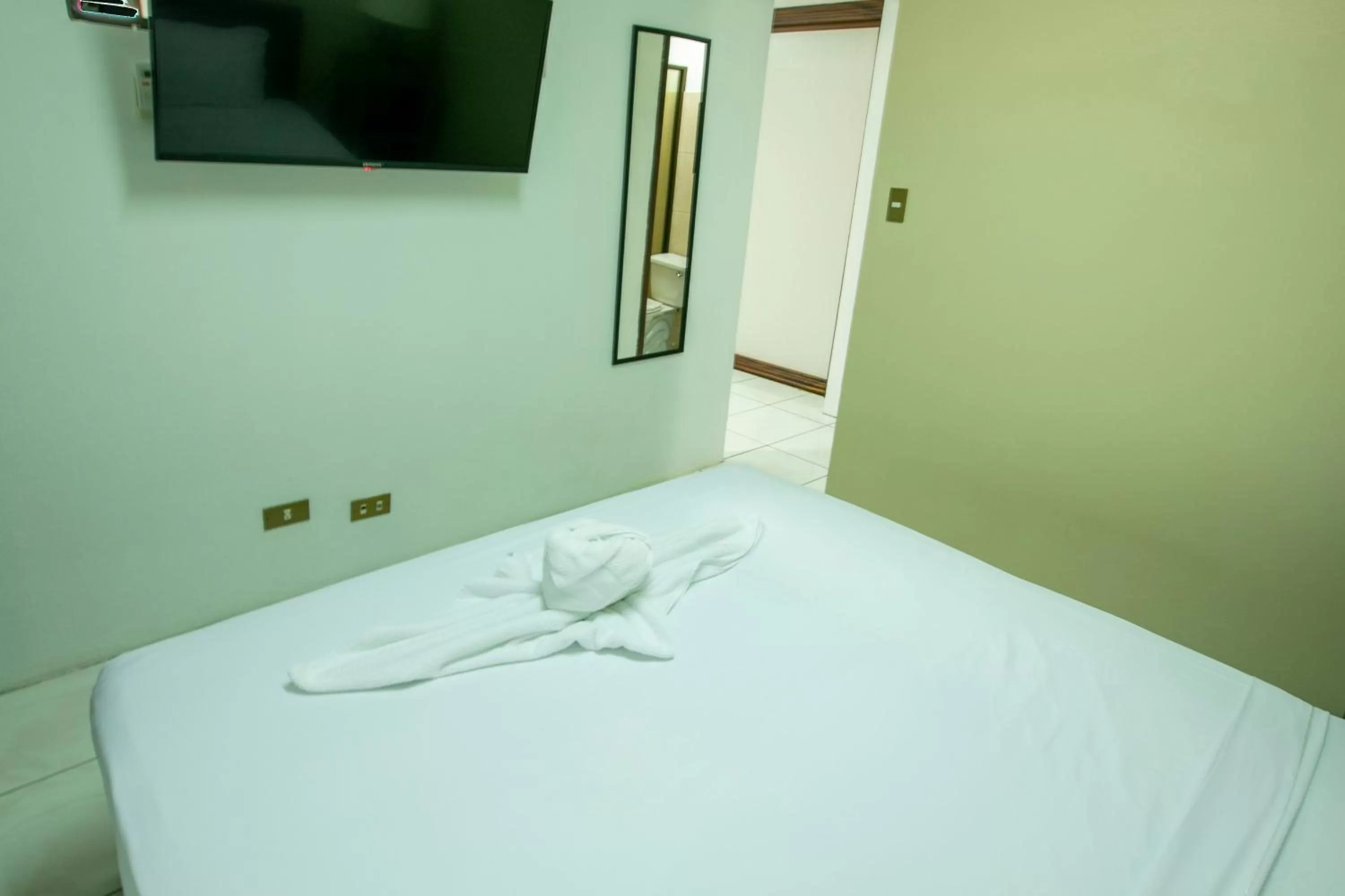 Bed in Coati Arenal Lodge