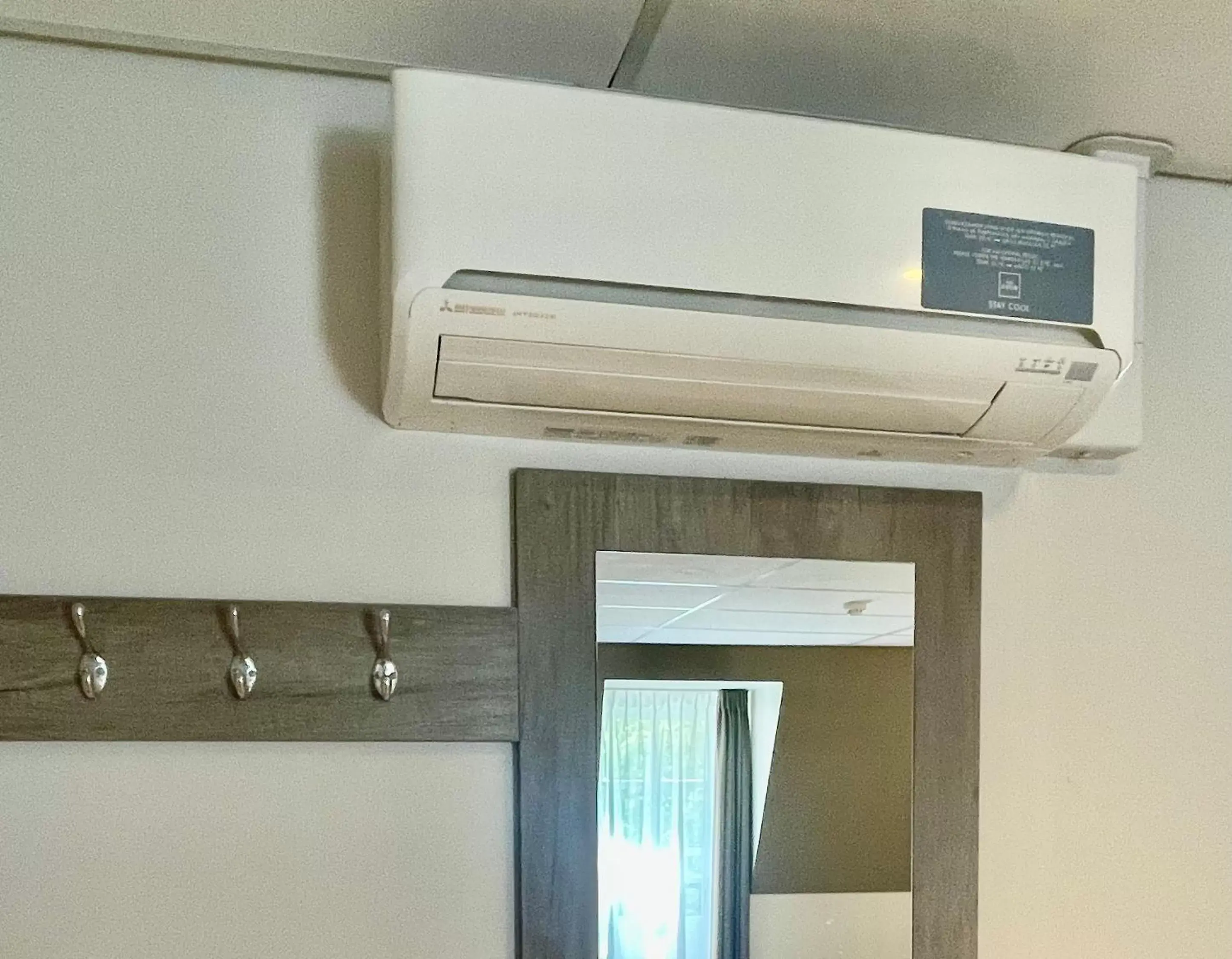 air conditioner, TV/Entertainment Center in Hotel De Koepoort