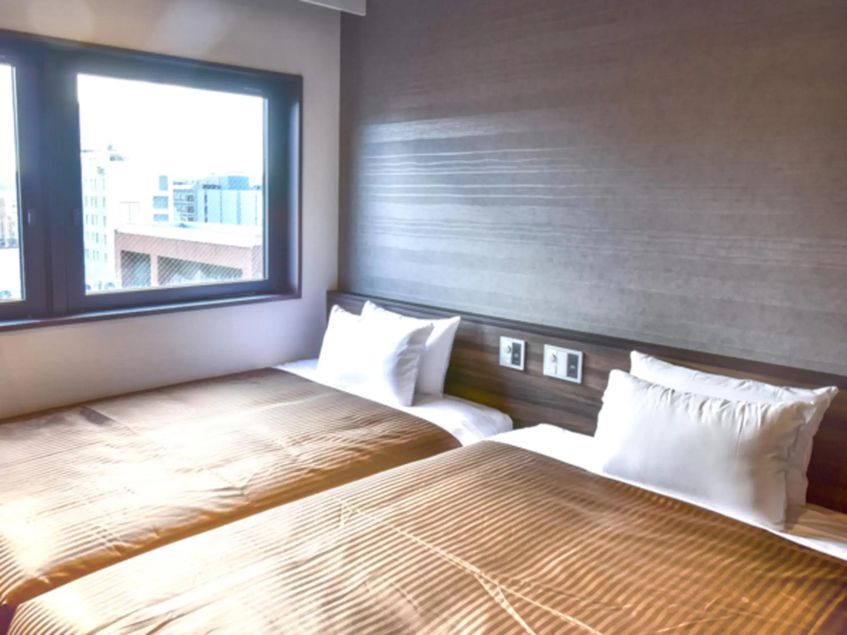 Bed in HOTEL LiVEMAX Fukuoka Tenjin West