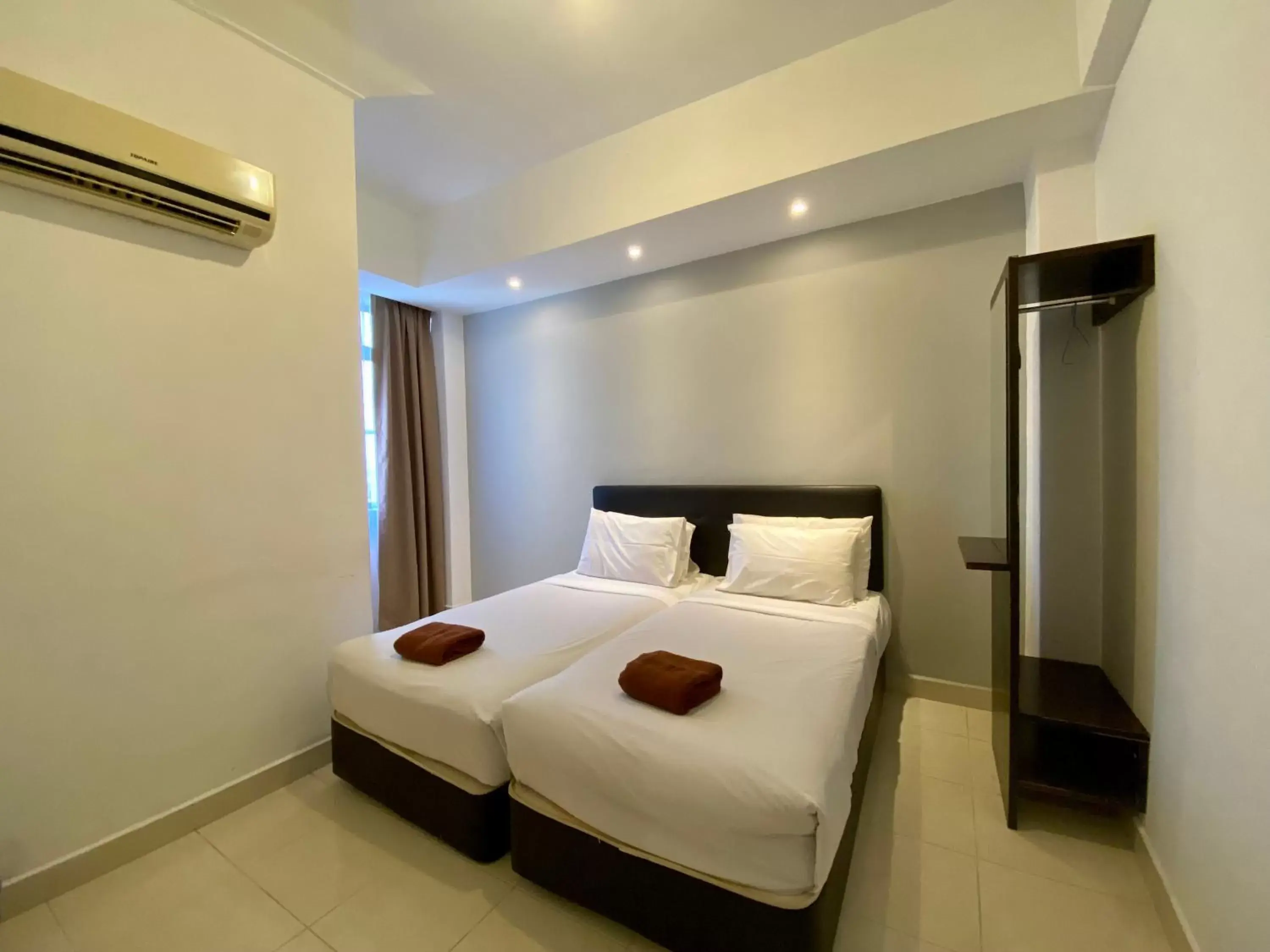 Bed in Sumai Hotel Apartment