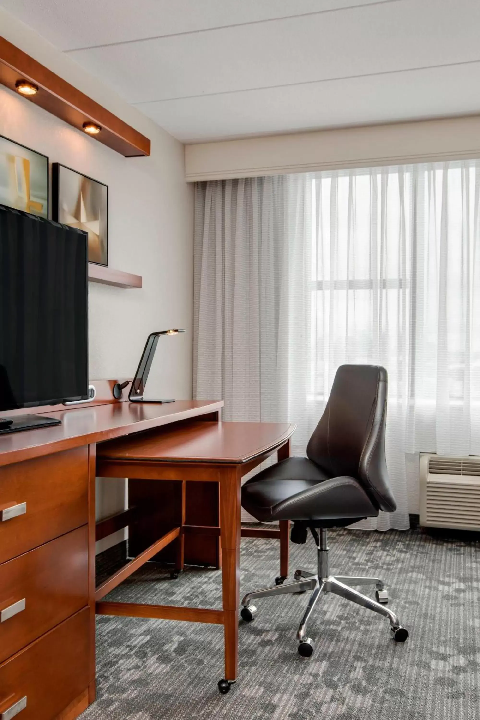 Photo of the whole room, TV/Entertainment Center in Courtyard by Marriott Boston Logan Airport