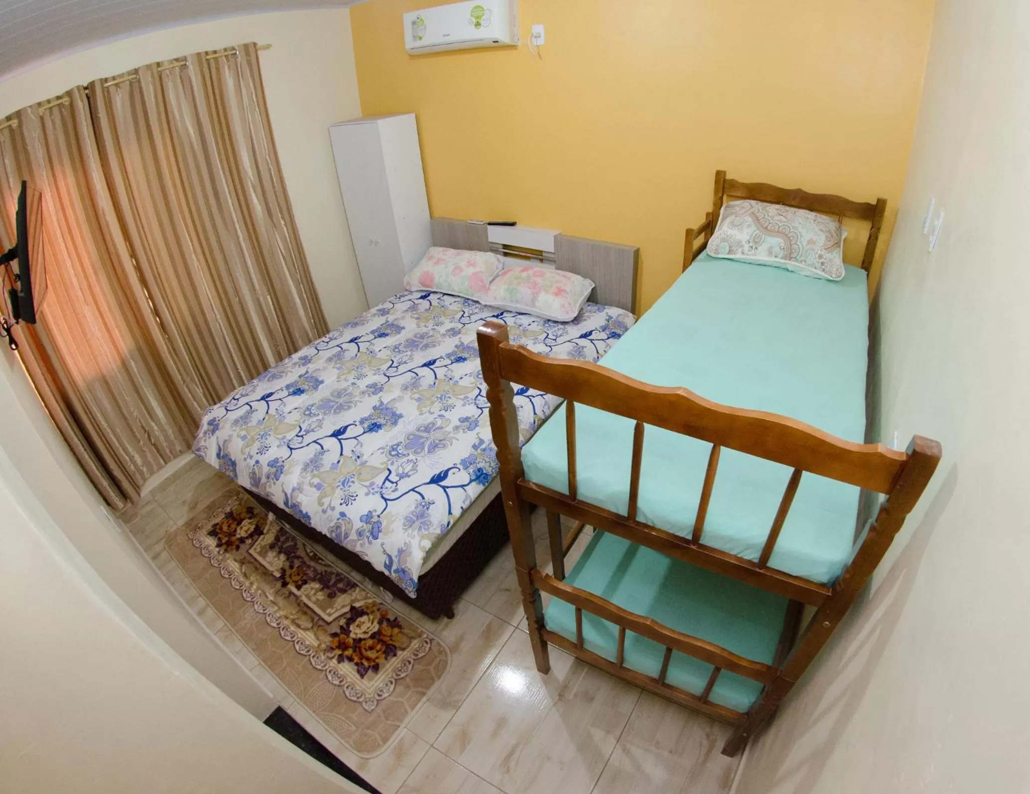 Bed in Pousada Família Cordeiro