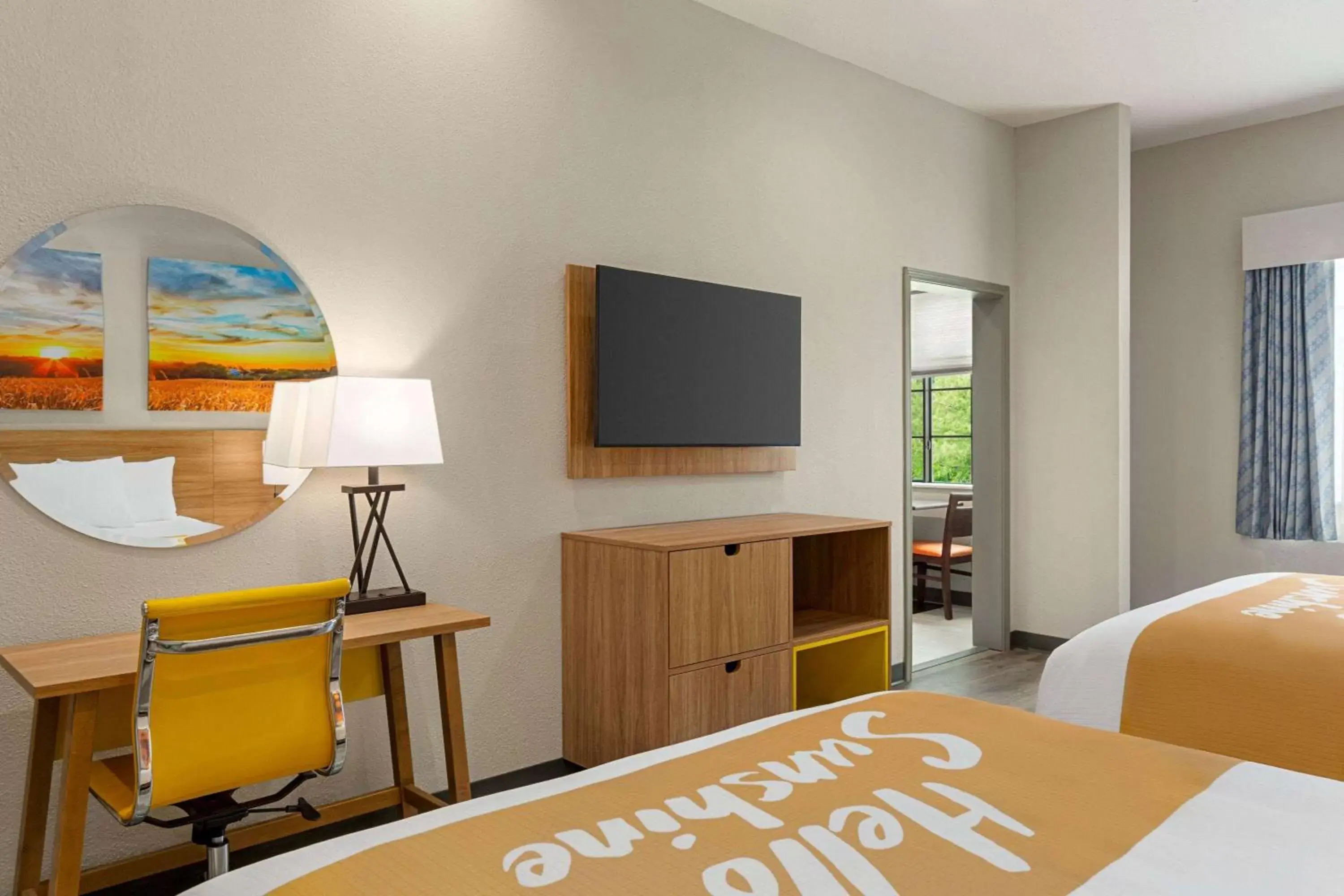 Bed, TV/Entertainment Center in Days Inn & Suites by Wyndham Greater Tomball